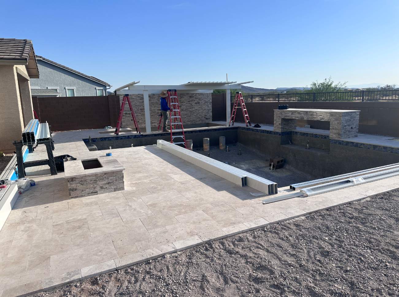 Pool build with custom water features & pergola by Modern Pools