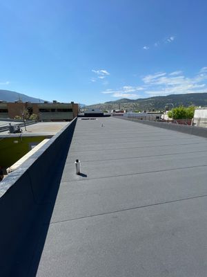 Commercial ReRoofing Installation using IKO 2ply sbs