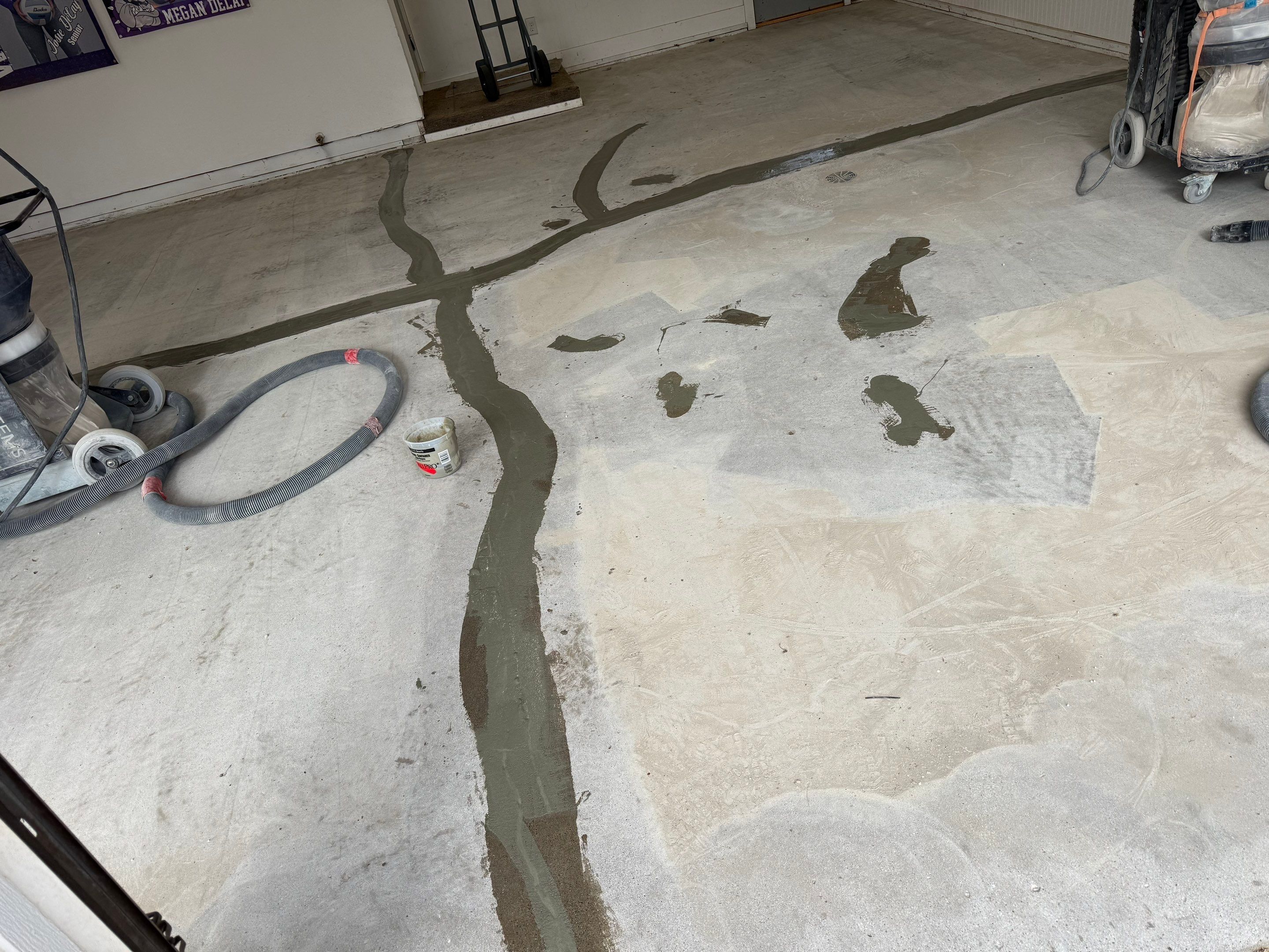 Feather Grey Garage Floor Coating and Crack Repair in Beresford by Select Painting, Coatings & Garage Cabinets