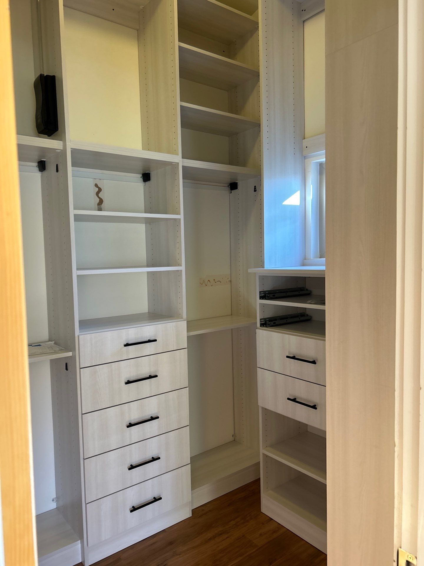 Walk-in Closet in a Small Space by Concept 32, Inc.