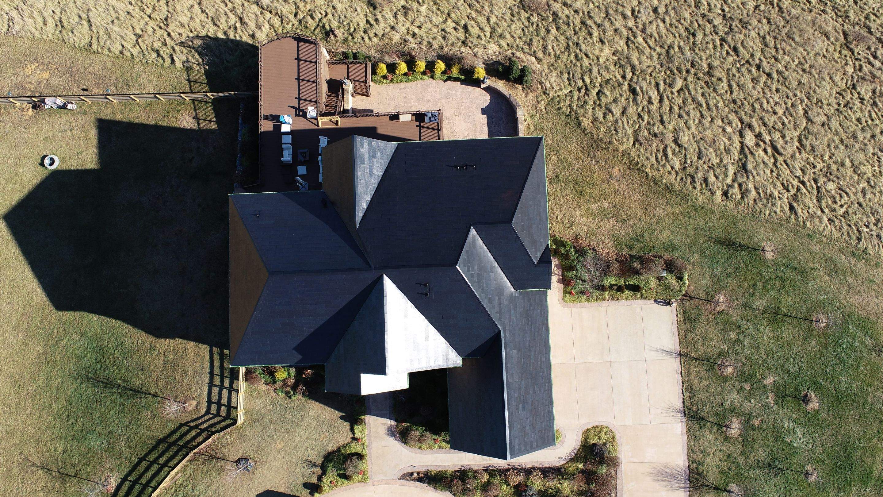 Tesla Solar Roof Replacement by American Home Contractors