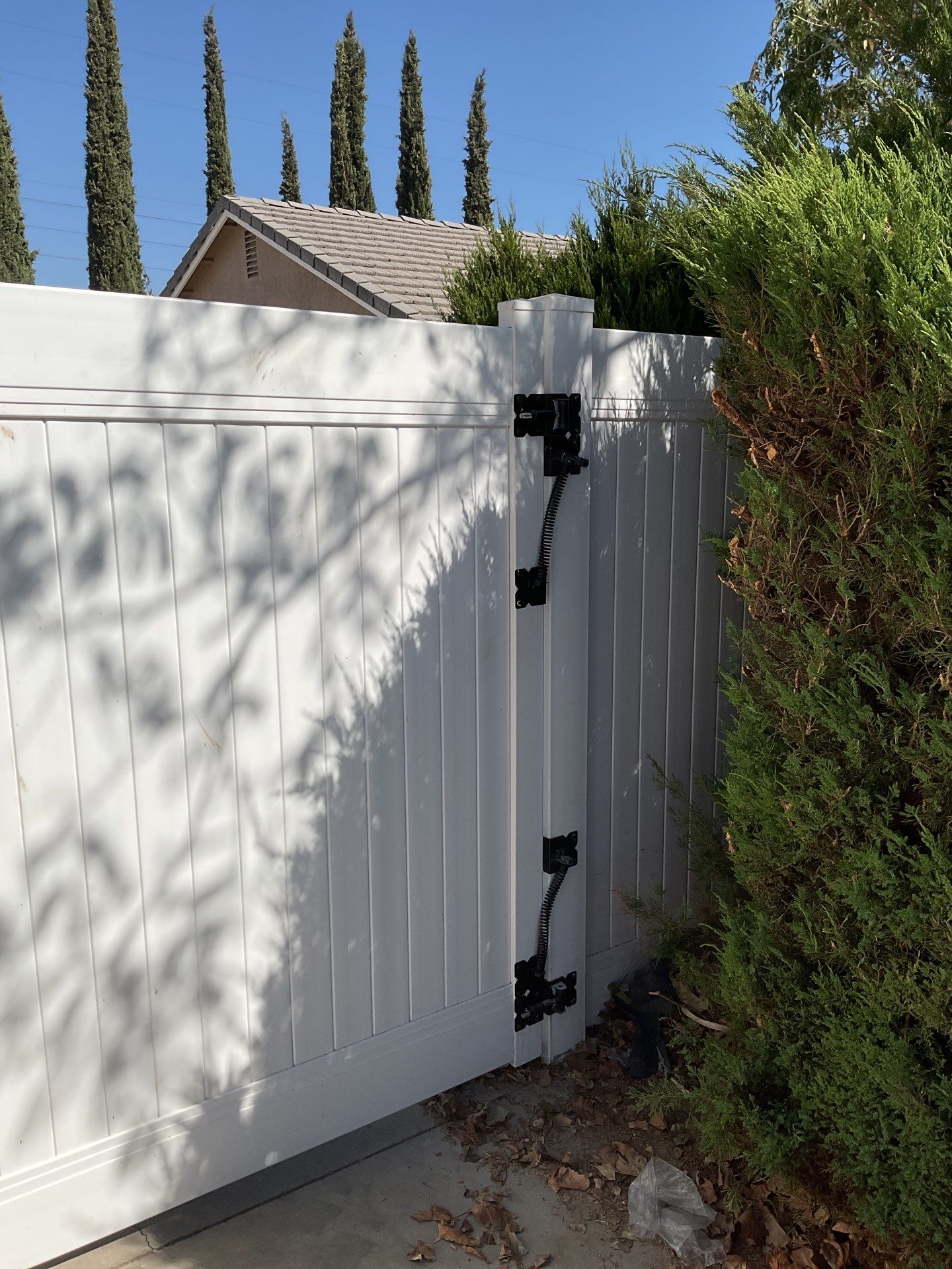 Gate installation using Vinyl by Fence Guys Inc. 