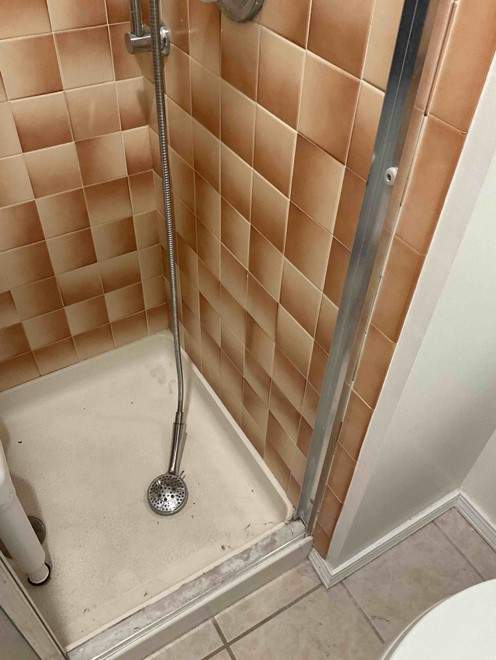 New shower, flooring, and countertop by The Shower Company