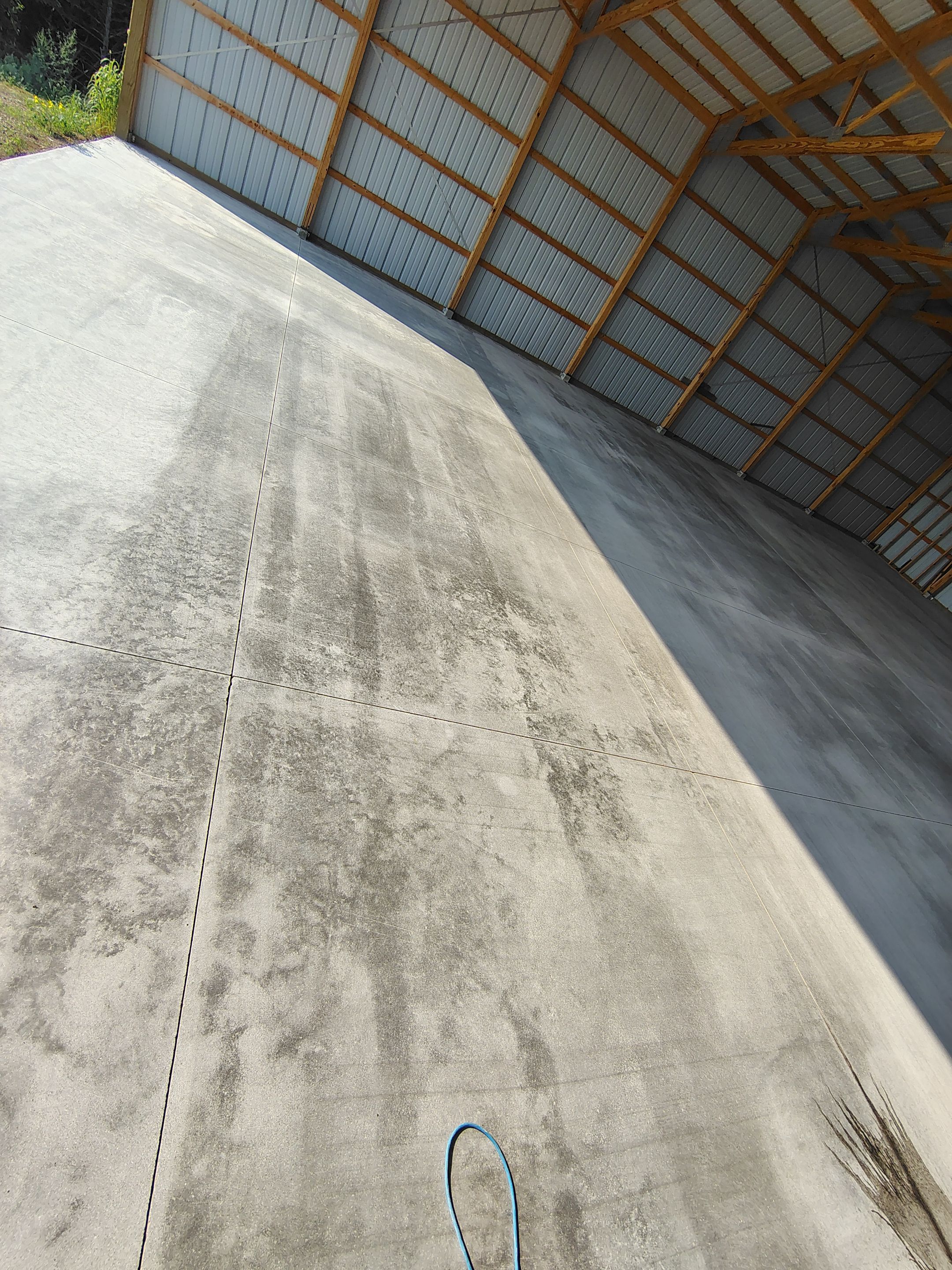 Durable Grey Speckled Epoxy Floor Coating for Yankton Shop by Select Painting, Coatings & Garage Cabinets