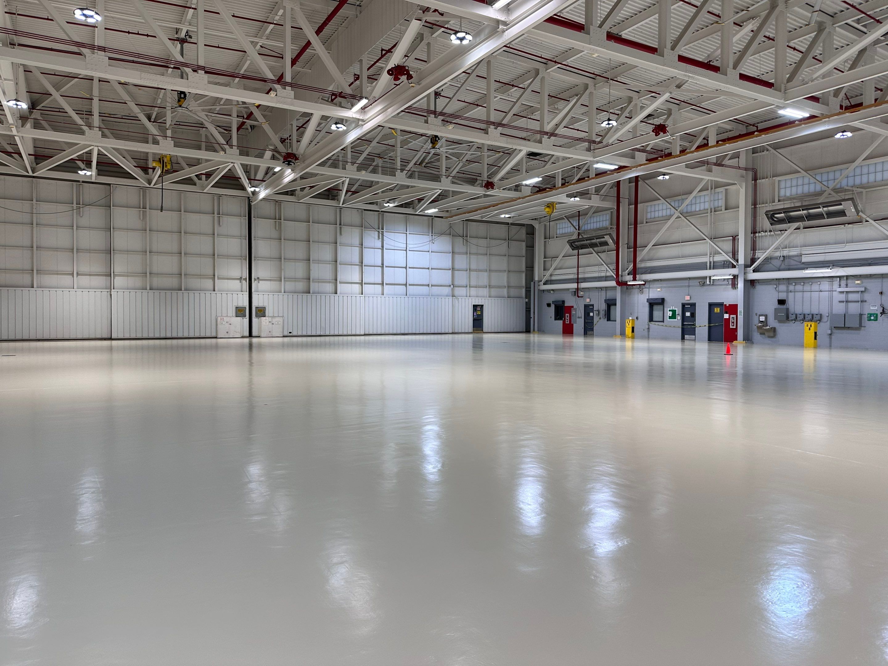 Industrial Epoxy Flooring for Army National Guard Hangar in Mobile by Cornerstone Hard Surface Restoration 