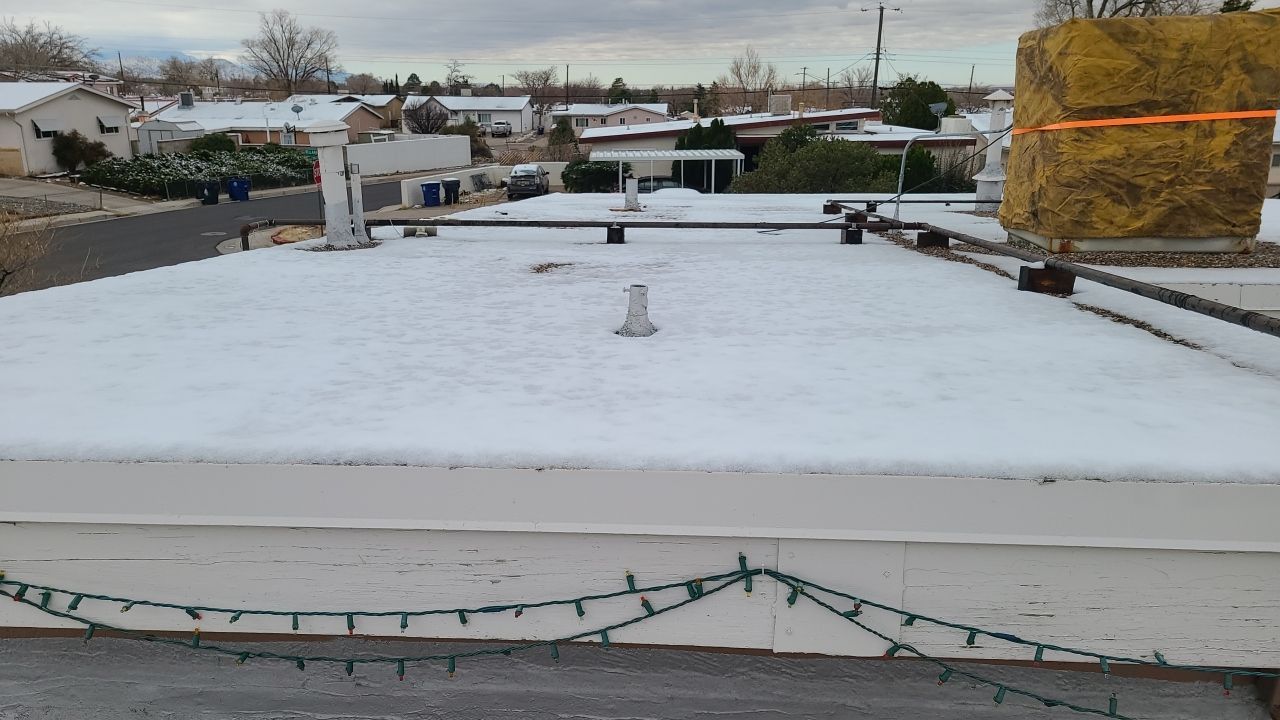 Residential TPO Roof Replacement and skylight replacement in Albuquerque by Doyle Roof Masters Inc