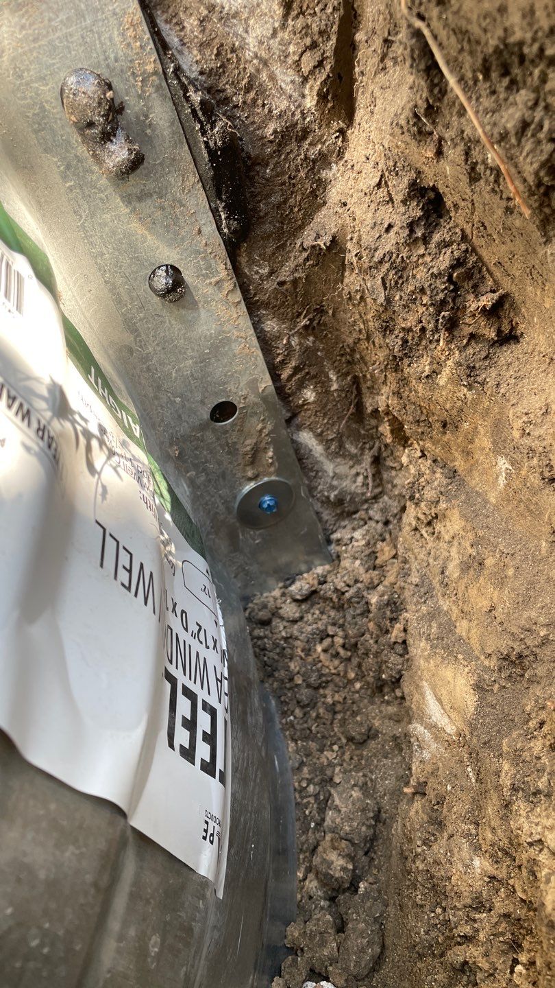 Drain Tile, Window Wells & Buried Discharge in Minneapolis by Waterproofing Northeast