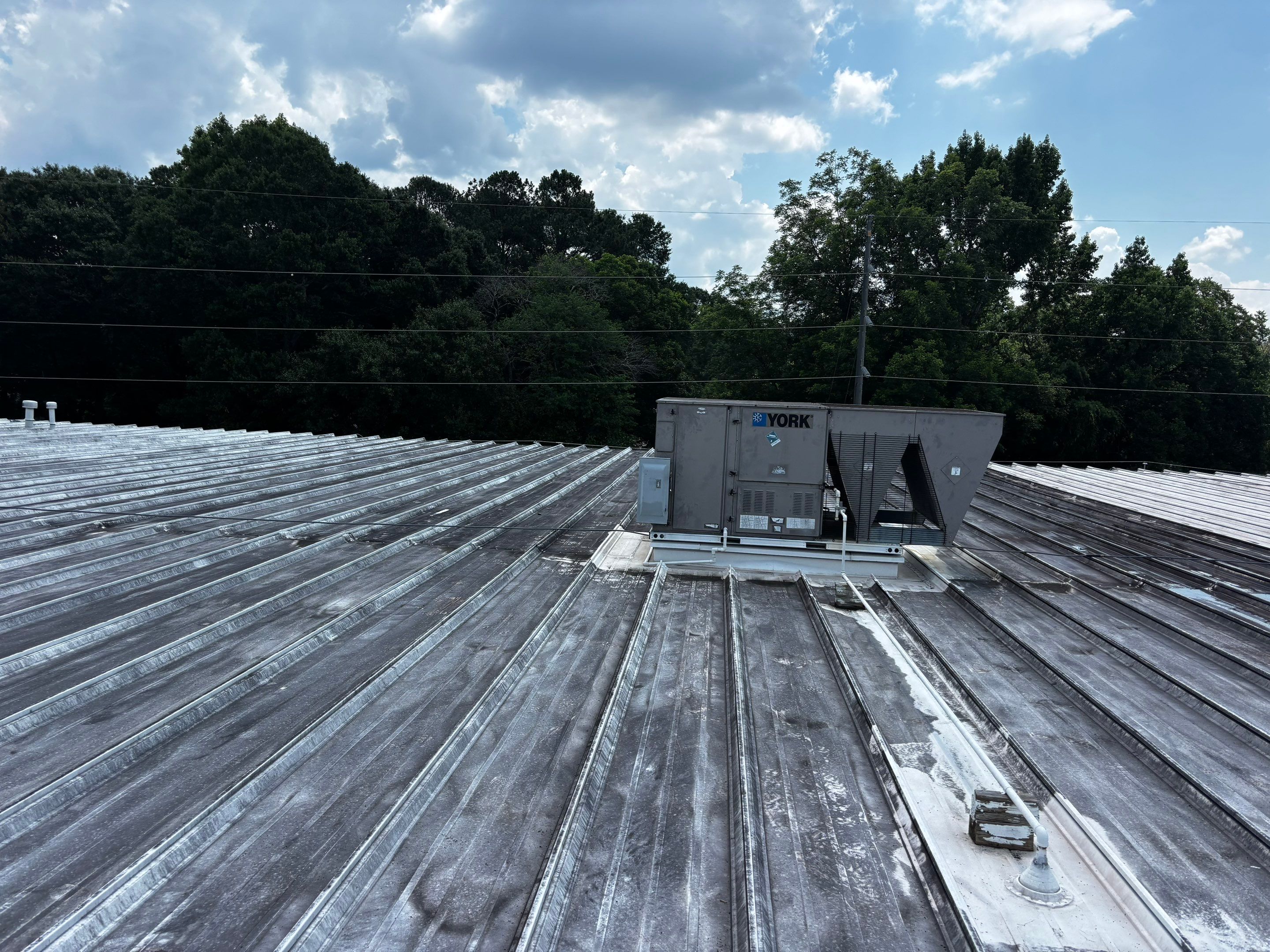 12,180 SQ Ft Commercial Metal Roof Restoration in Clarkston by Southern Roof Solutions