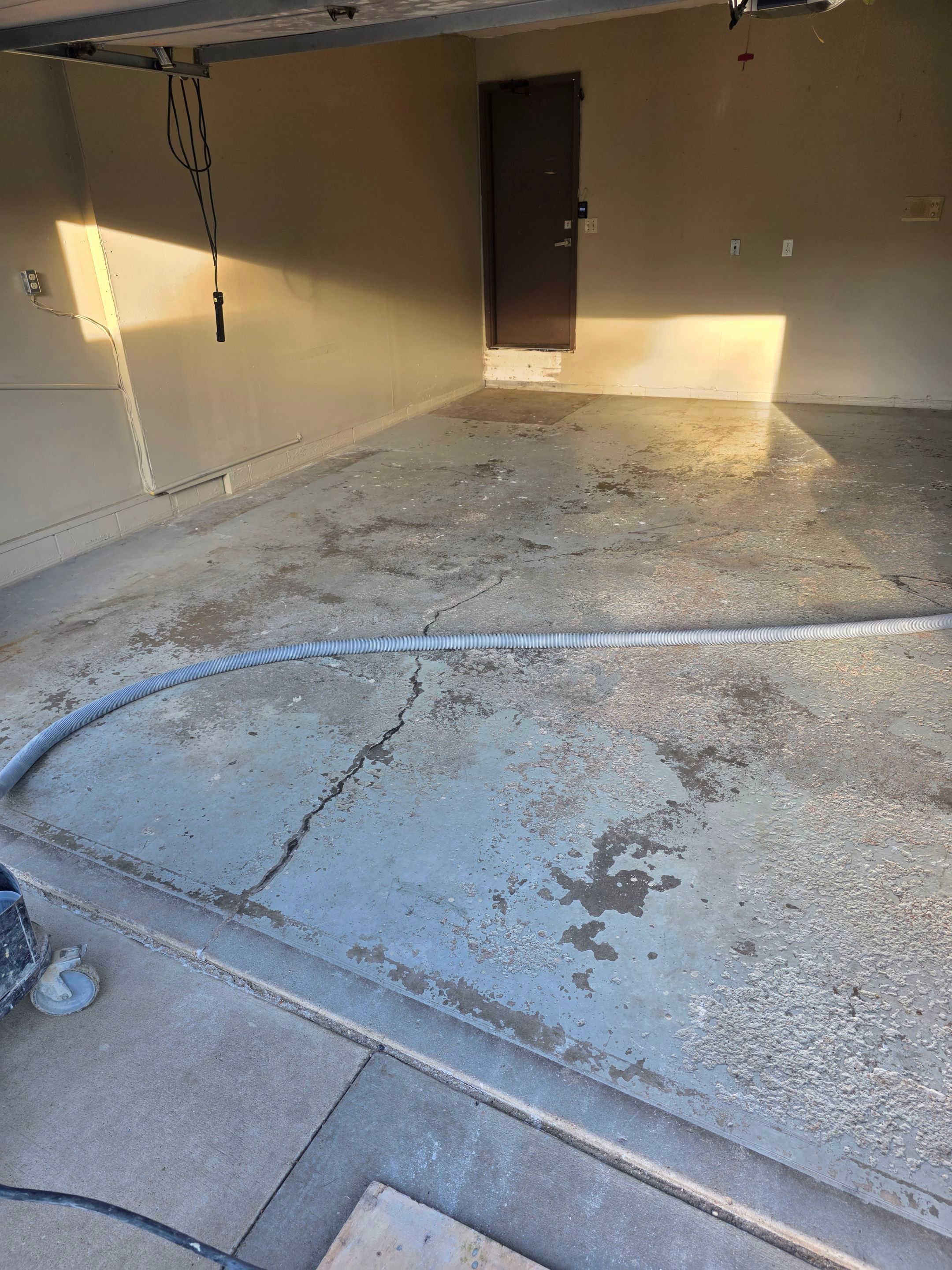 Residential Garage Epoxy Floor Coating Installation in Sioux Falls by Select Painting, Coatings & Garage Cabinets