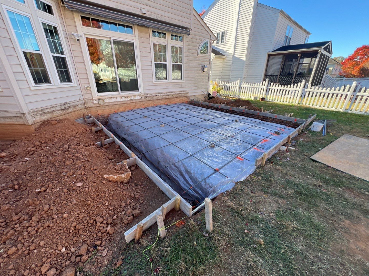 Custom Screened-In Porch with Stamped Concrete Patio in Warrenton by Jakari Restoration & Construction LLC