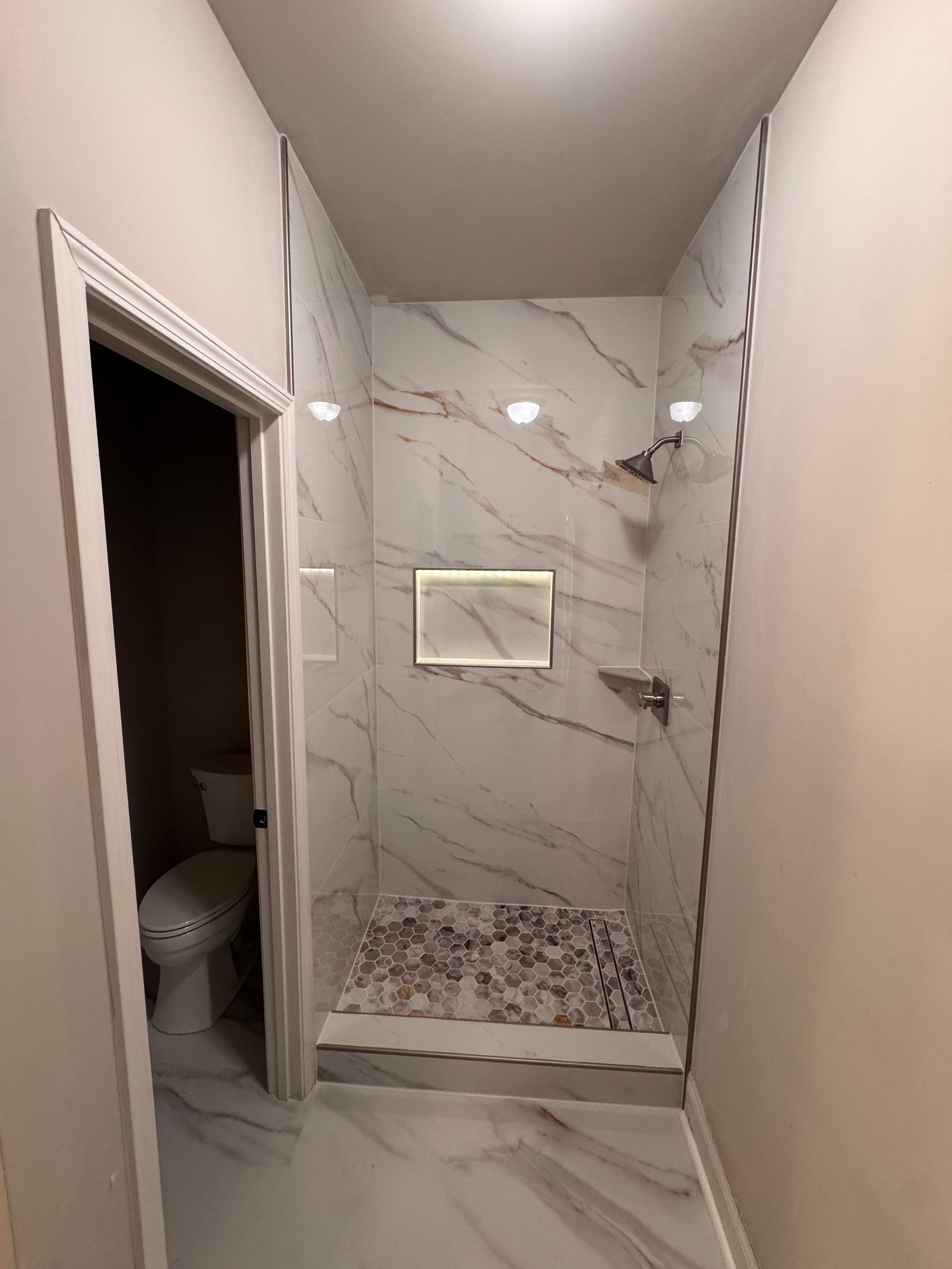 Three showers renovation by Prudencio