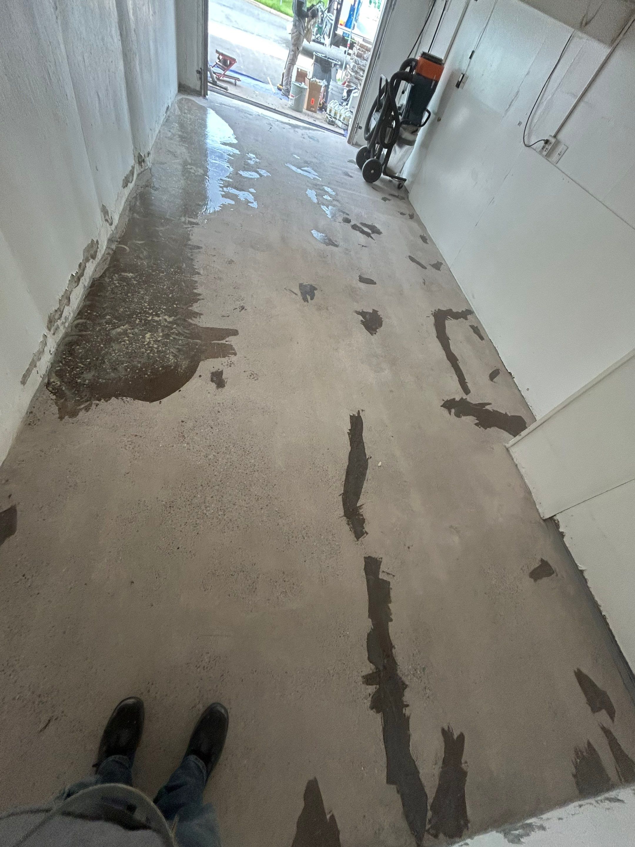 Garage Concrete Floor Coating Transformation  by DiGiorgi Roofing and Siding Inc