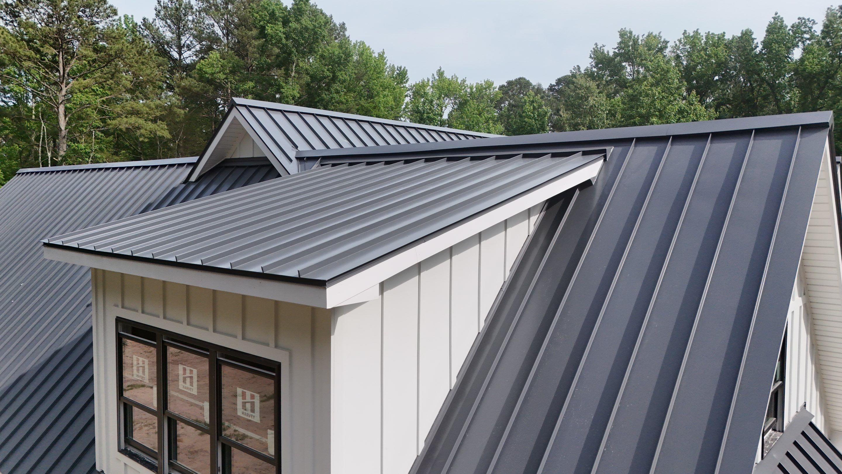 Custom New Construction Home Featuring Standing Seam Metal Roofing in Port Haywood by Cade Construction