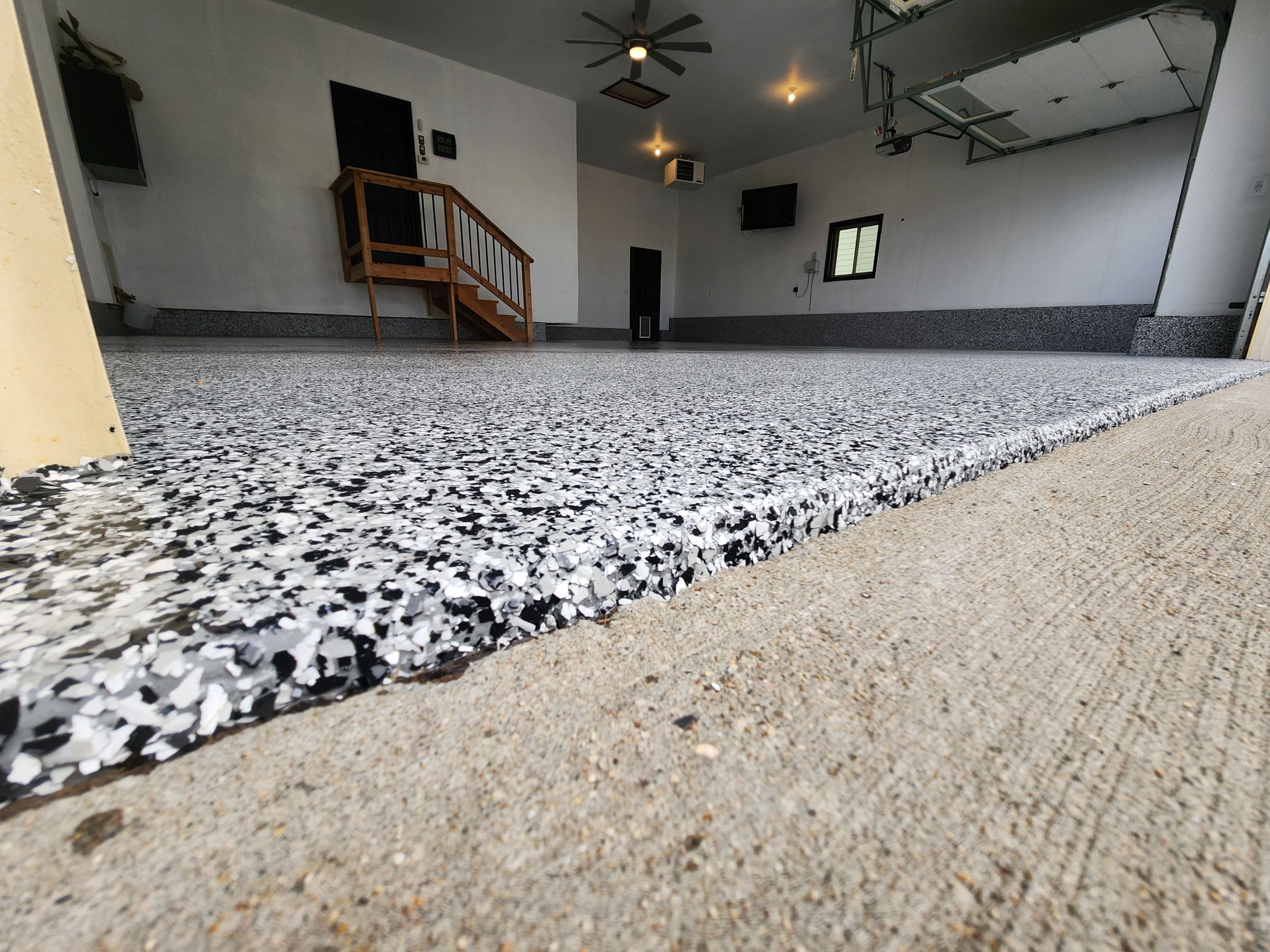 Domino Flake Garage Floor Epoxy Coating in Brandon by Select Painting, Coatings & Garage Cabinets
