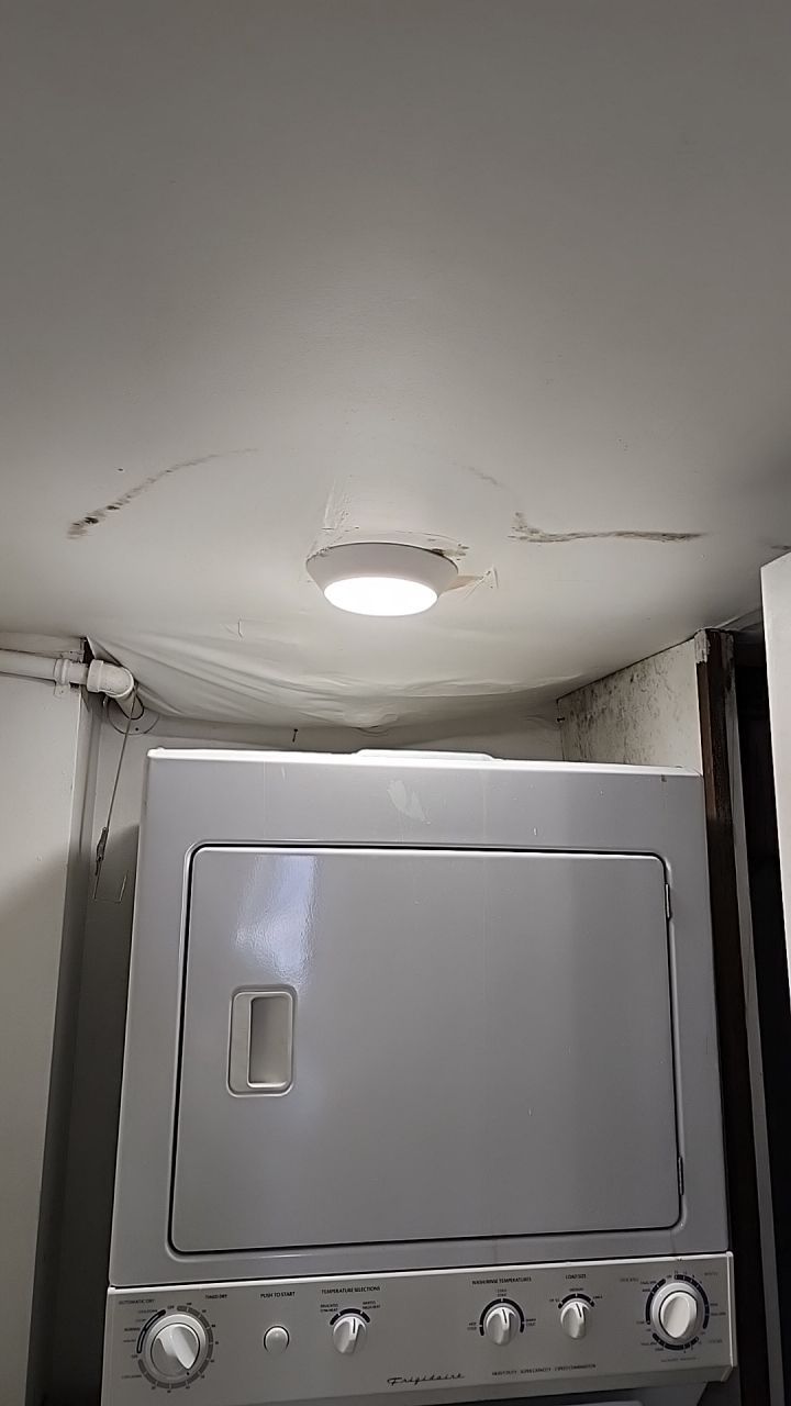 Damage caused from leaking water hea  er by Building performance Solutions LLC
