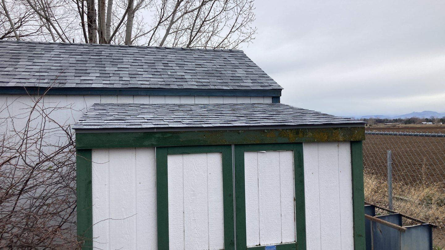 Two story farmhouse style roofing installation using Owens Corning Duration in the color Teak by ID Roofing LLC