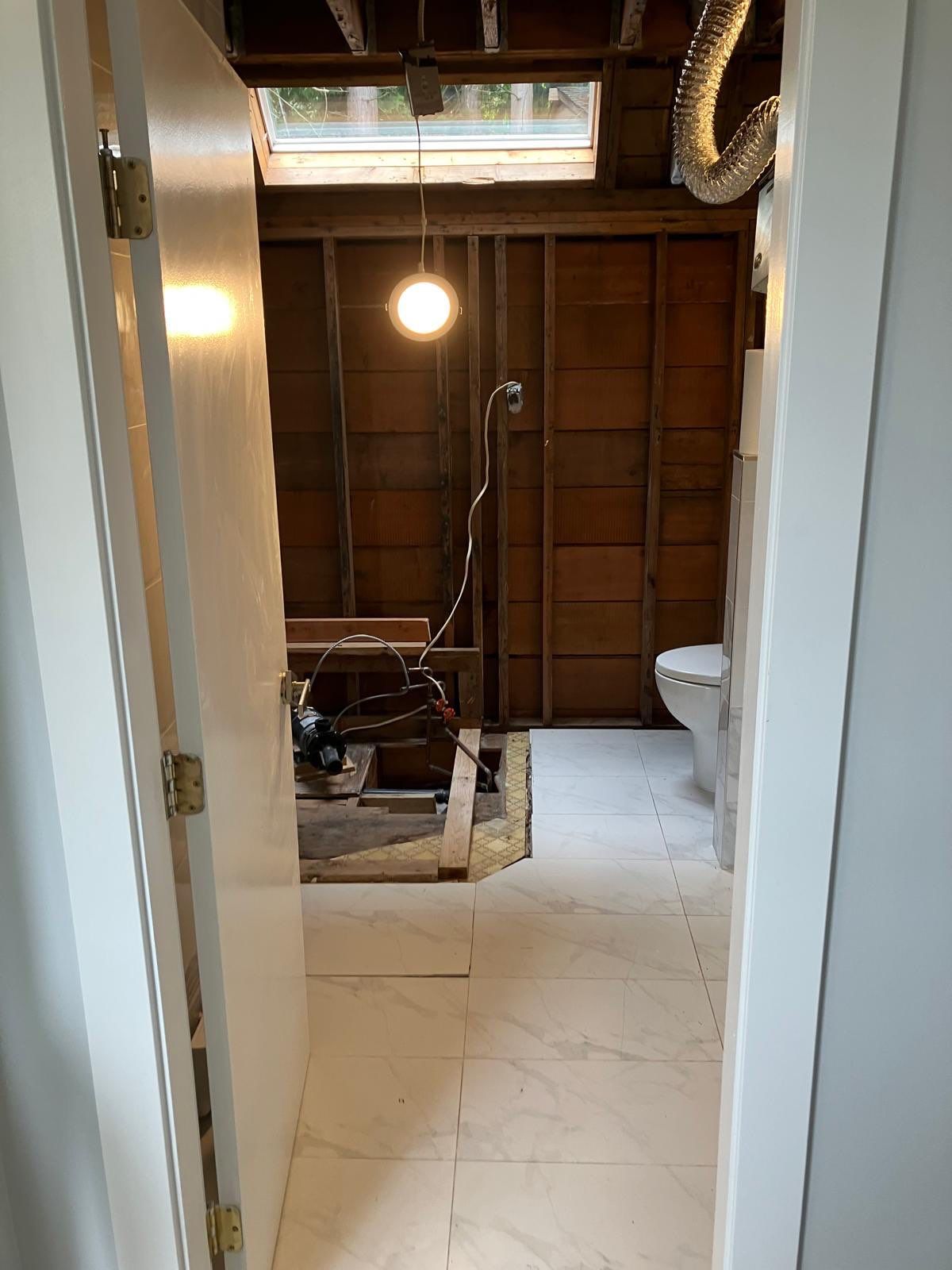 Water Damage Restoration & Bathroom Renovation in West Vancouver by YVR Construction Group