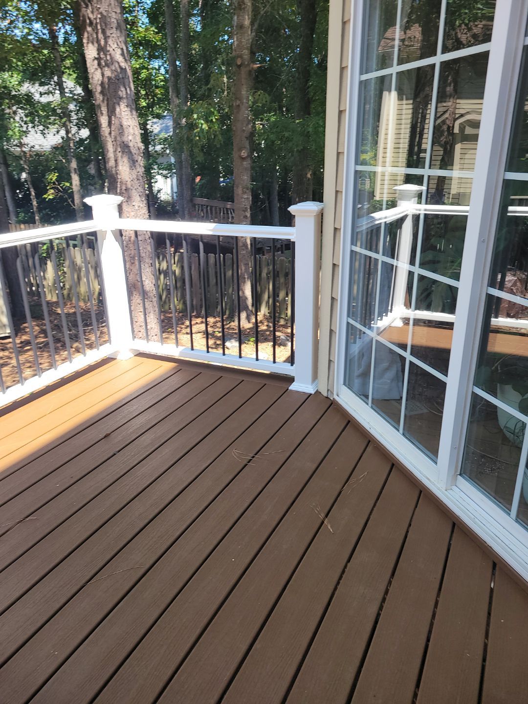 Fuquay-Varina Outdoor Upgrade – Composite Deck & Paved Landing by Elite Remodeling and Design LLC