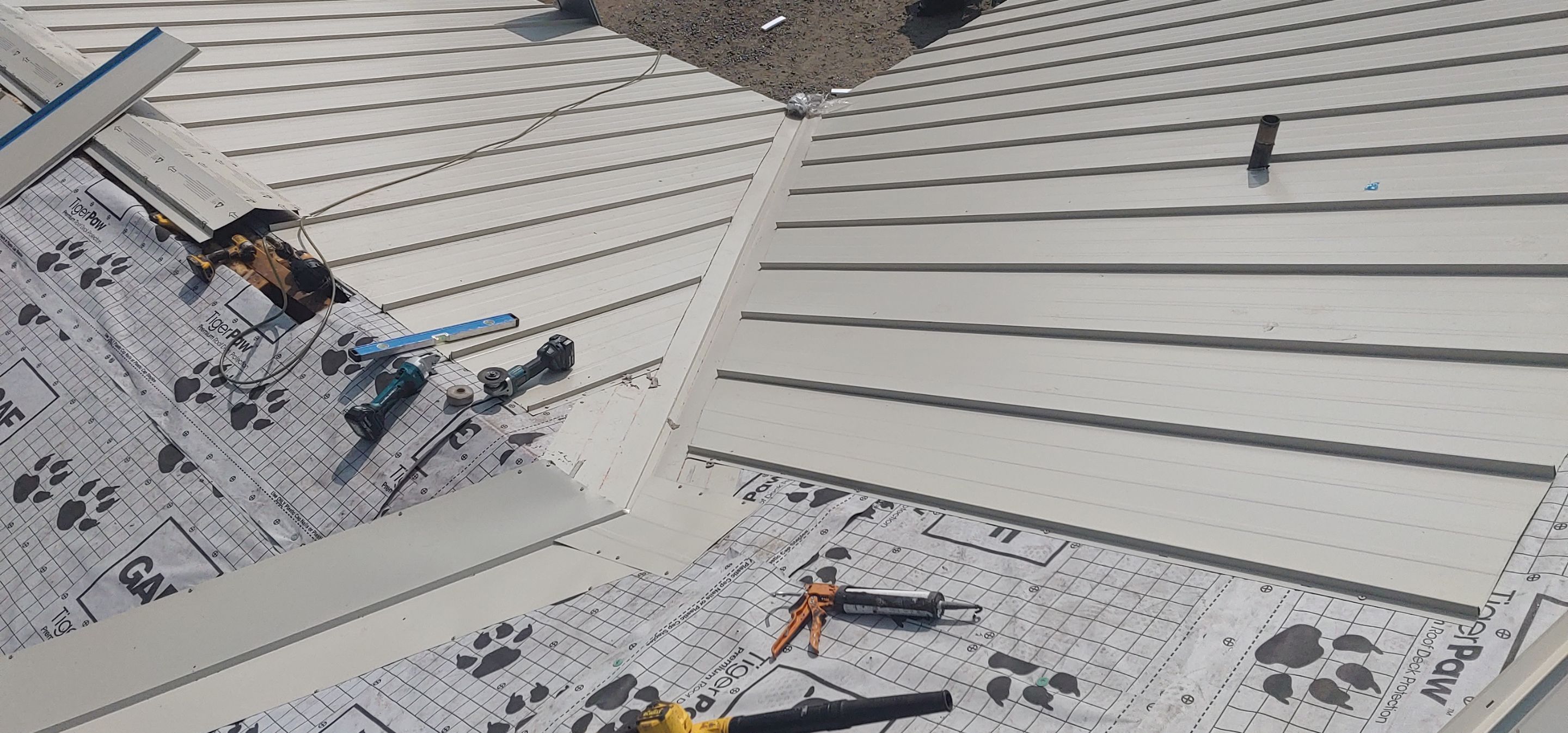 Residential Roofing Installation using Standing seam metal roofing system by Straight Edge Roofing Inc