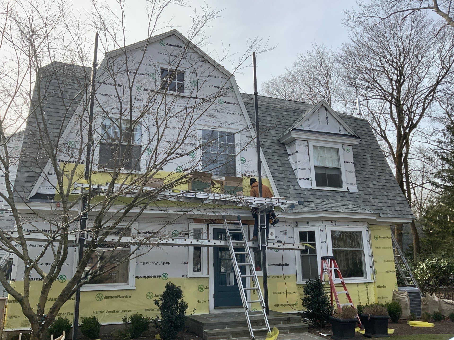 White cedar shingles and windows in Wayland, MA by UBrothers Construction