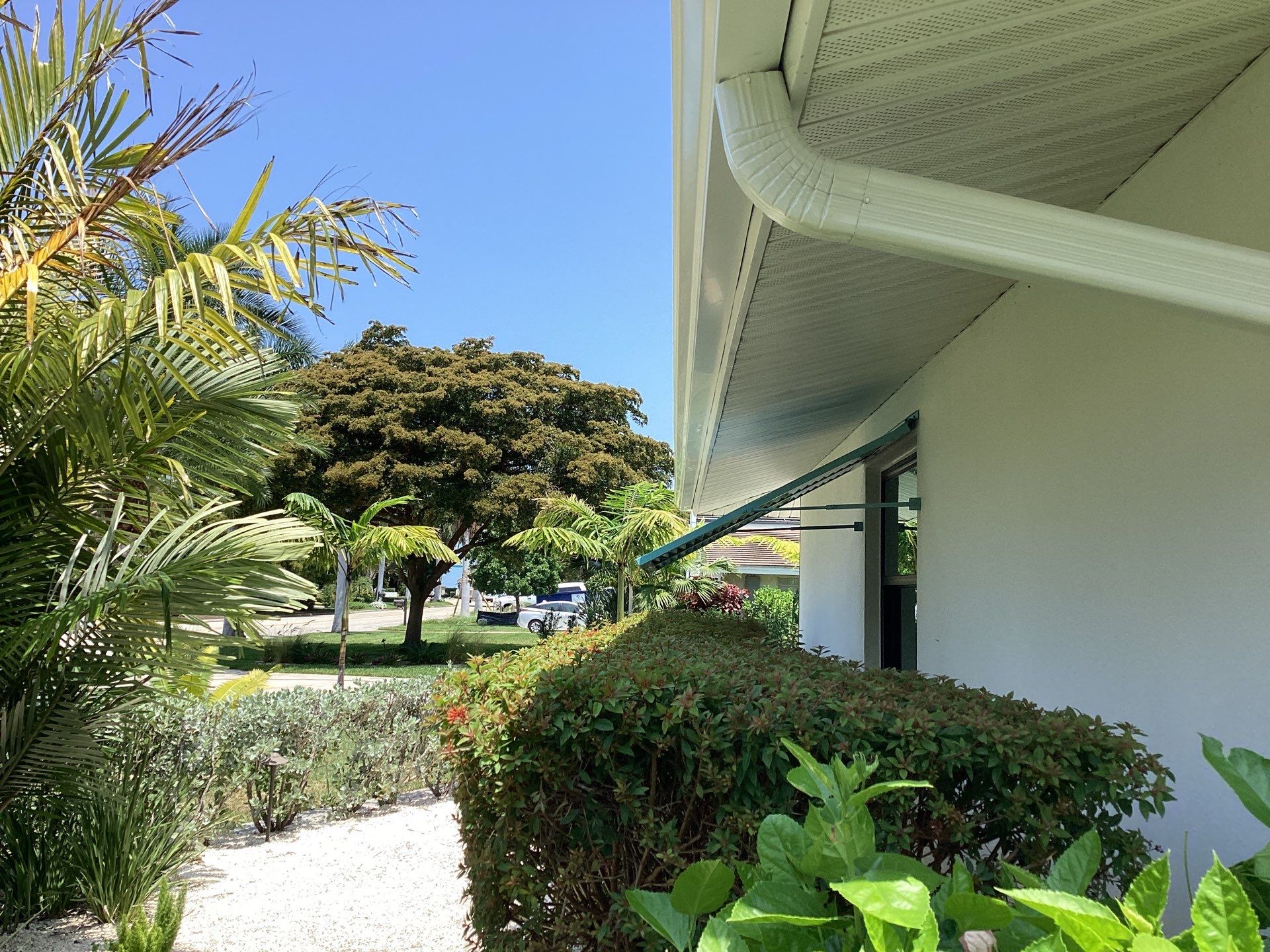 White Seamless Gutters and Downspouts in Sarasota FL by Gutter Professors