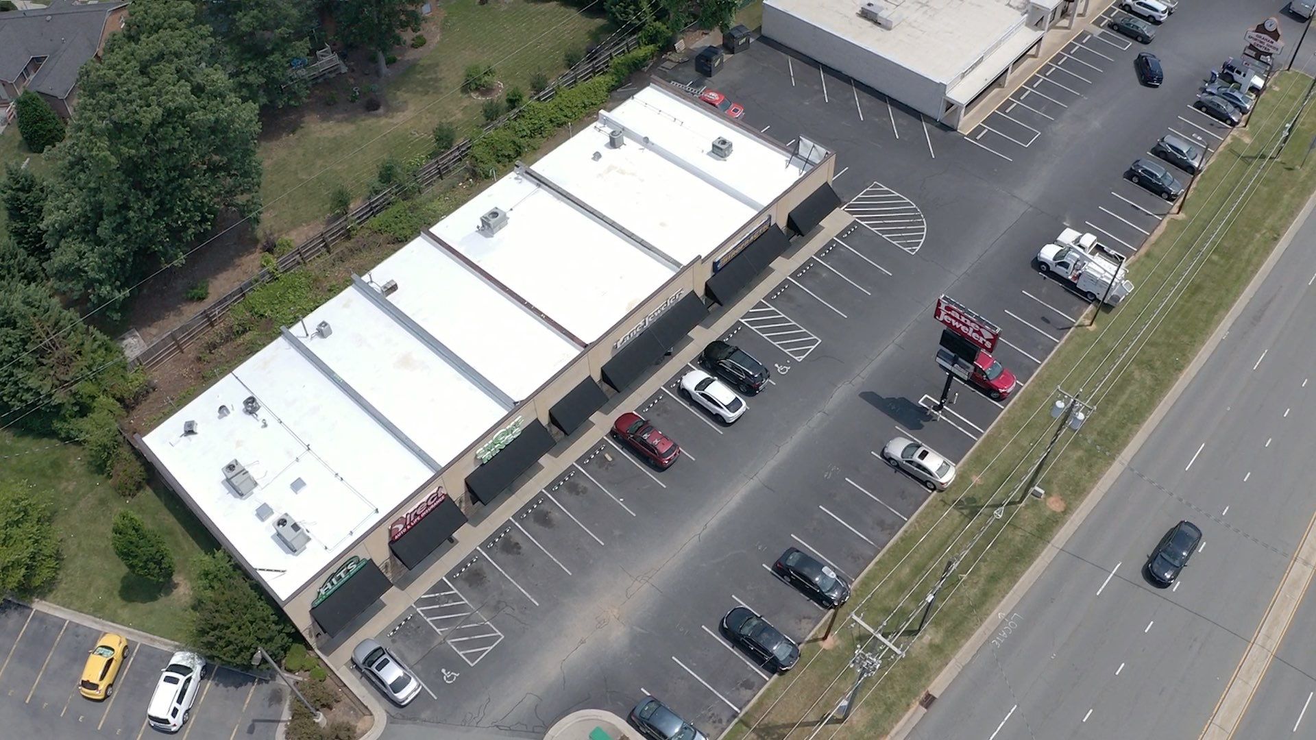 Commercial Roof Coating using Fiberseal basecoat and Silicon Topcoat by Just In Time Roofing and Restoration