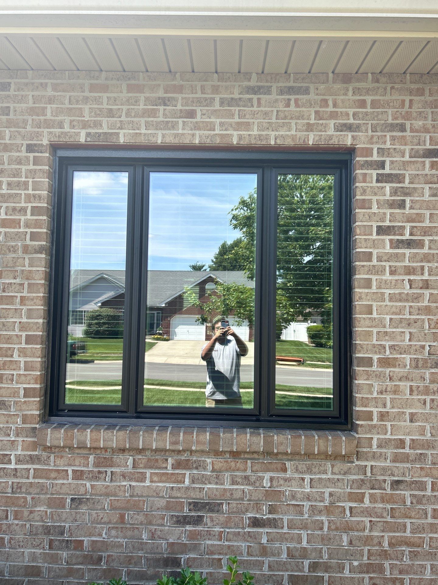 Black Vinyl Window Installation by Merrifield Exteriors, LLC