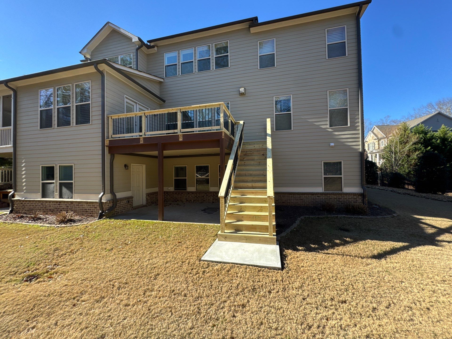 Custom Pressure-Treated Deck with Metal Balusters in Marietta by Swift Home Renovations