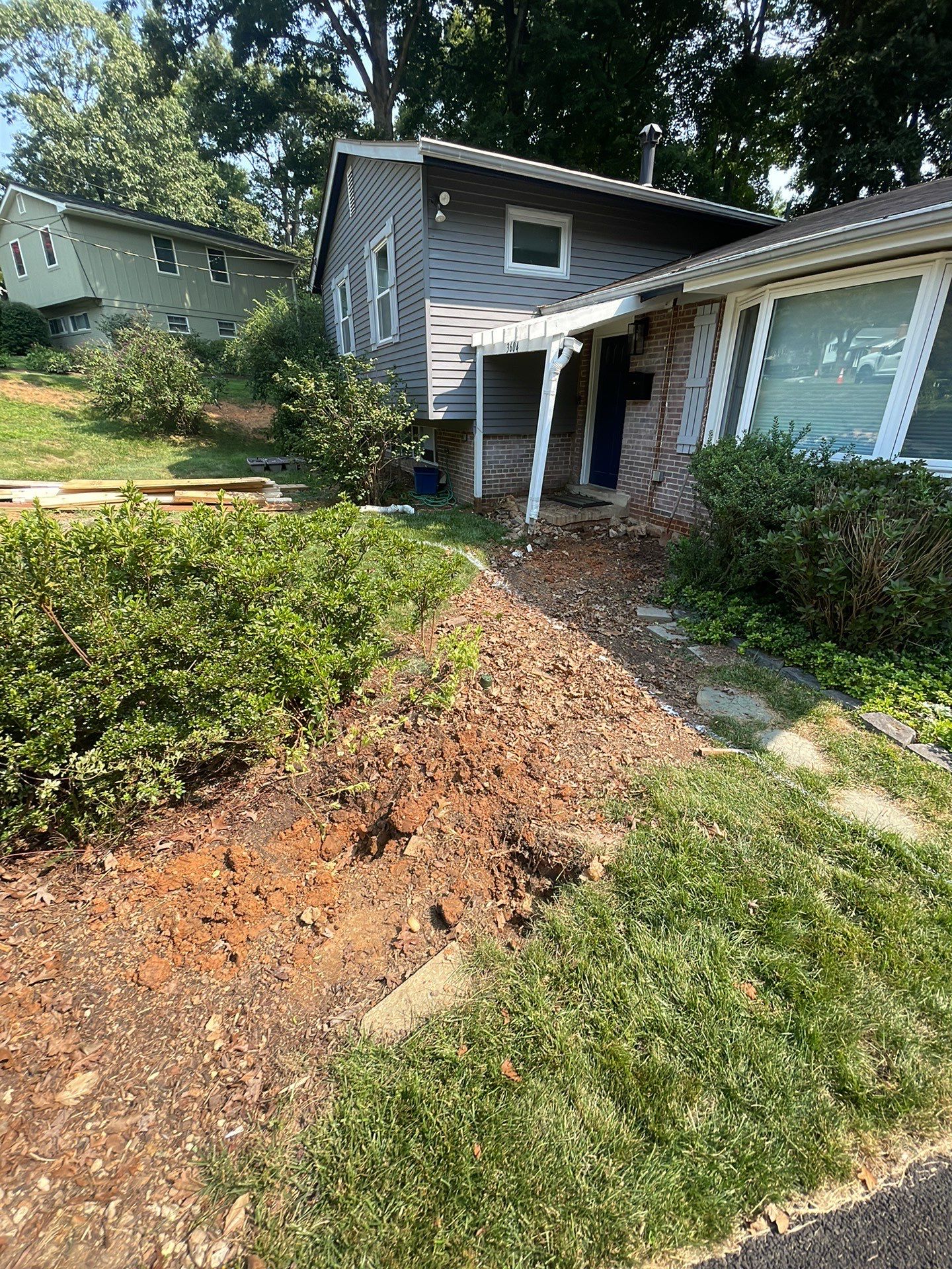 New walkway with stairs and a new front porch by Fairfax Contractors, LLC