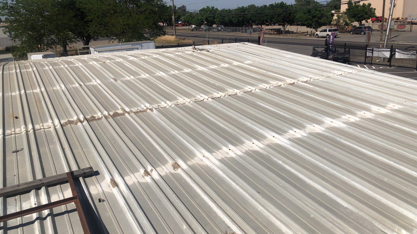 Metal Restoration Roofing system with Benchmark/PUMA XL 20 yr warranty by Straight Edge Roofing Inc