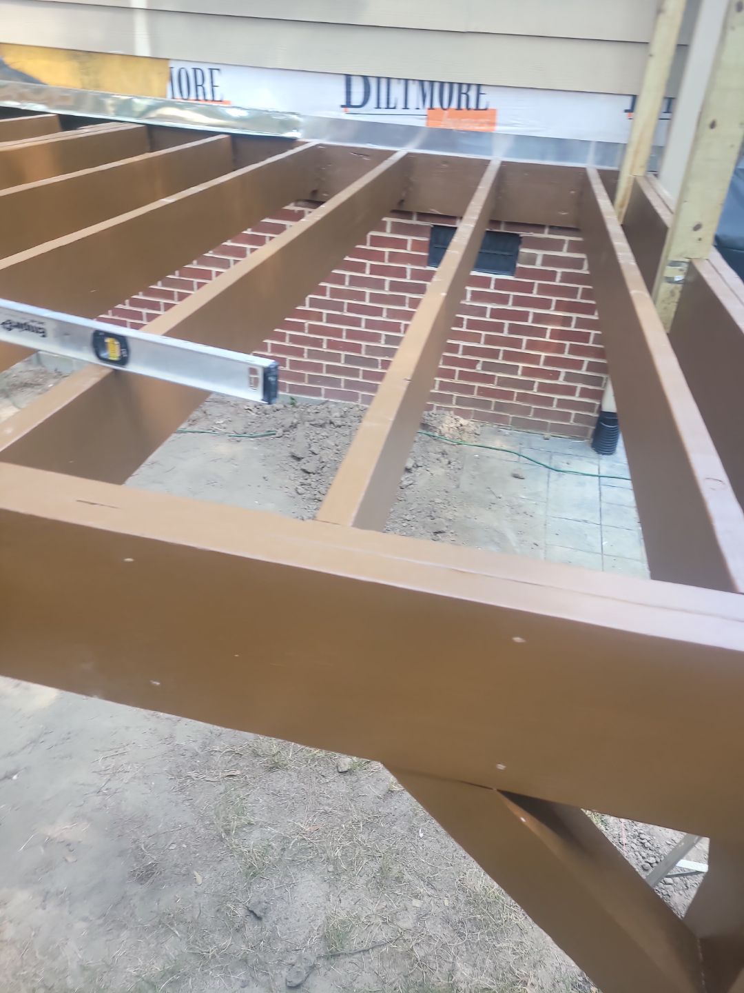 Fuquay-Varina Outdoor Upgrade – Composite Deck & Paved Landing by Elite Remodeling and Design LLC