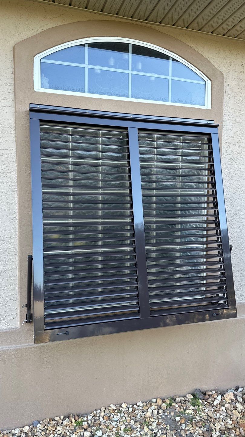 Hurricane Rated Bahama Shutters in Gray Brown by Smart Guard Shutters