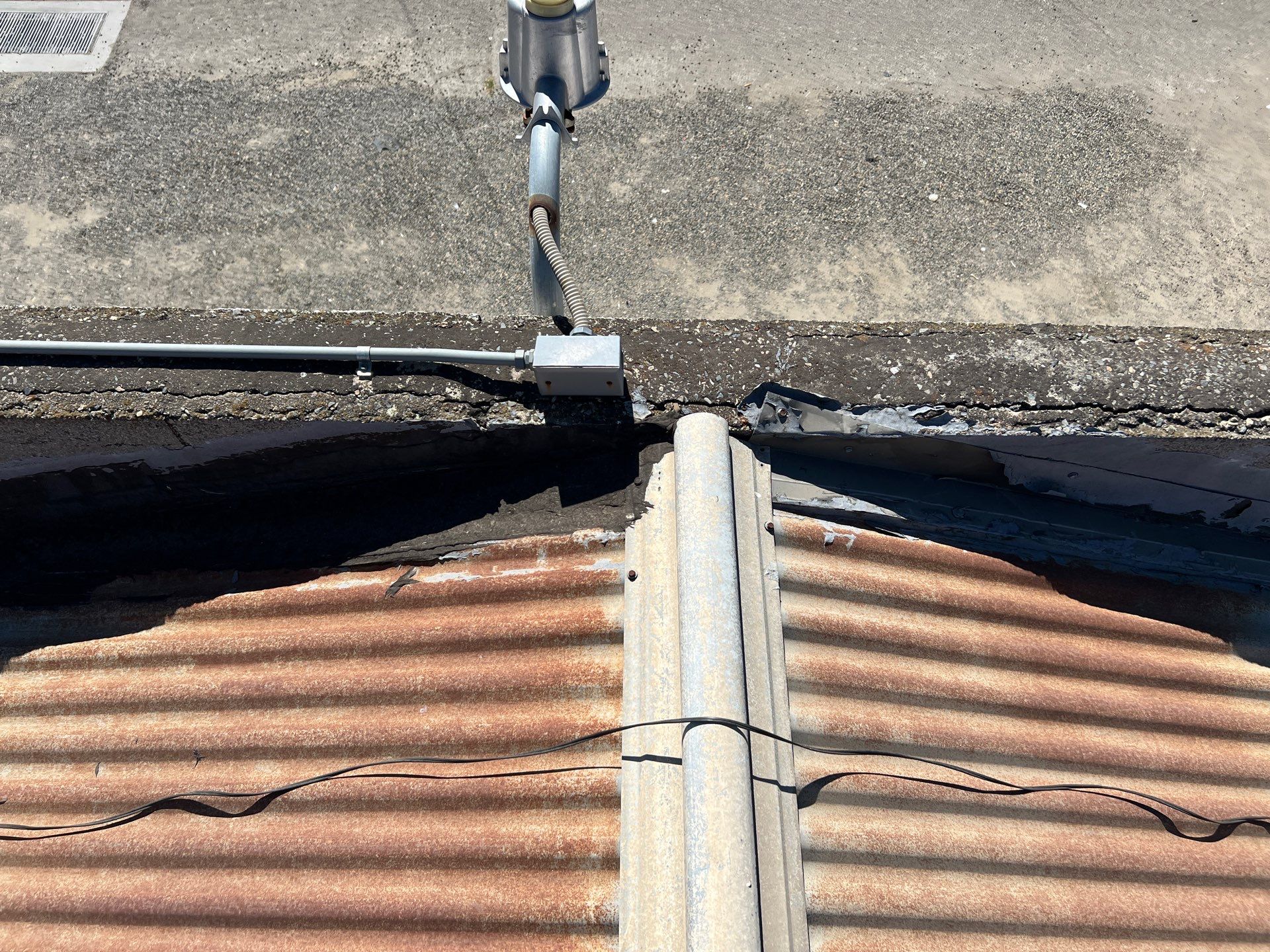 Spray foam and coatings using Conklin Benchmark/ PUMA XL acrylic coatings over metal and foam by Straight Edge Roofing Inc