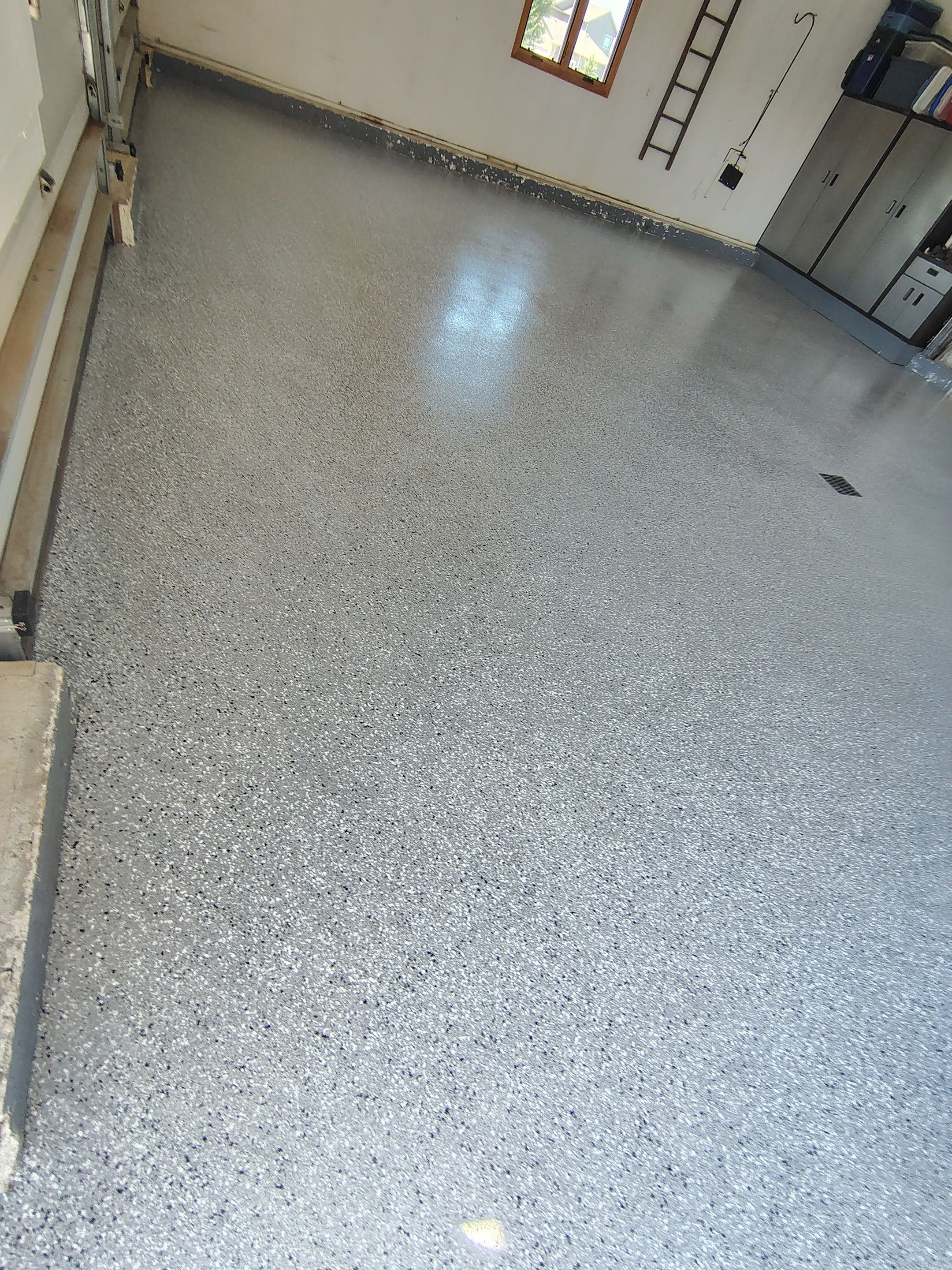 Feather Grey Garage Floor Coating Installation in Valley Springs by Select Painting, Coatings & Garage Cabinets