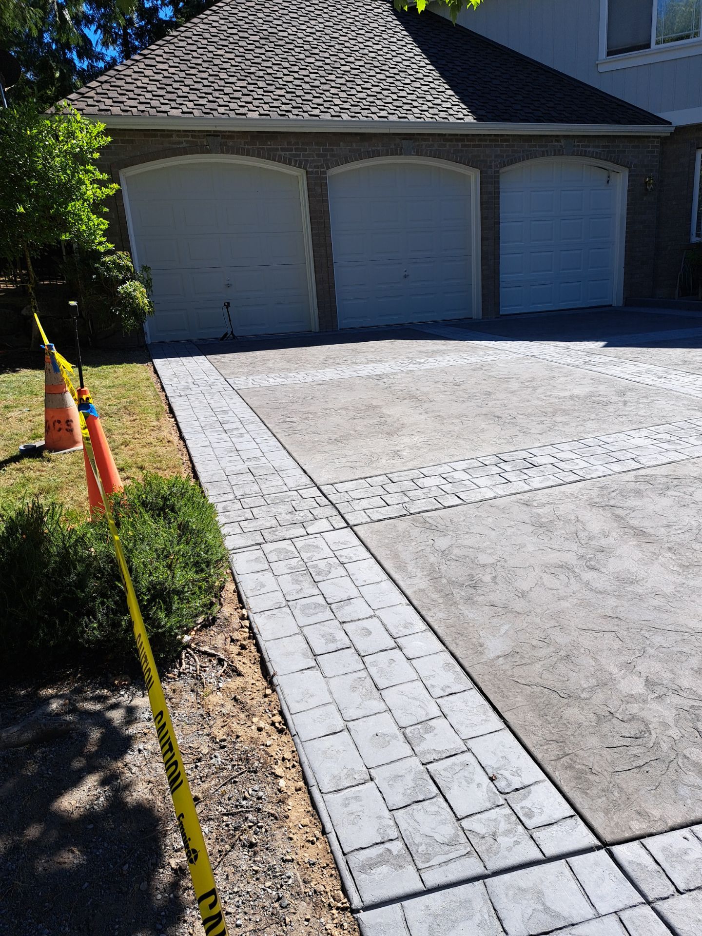 Multi-color Stamped & Sealed Concrete Driveway Renovation | Mukilteo by Jireh Asphalt & Concrete Inc