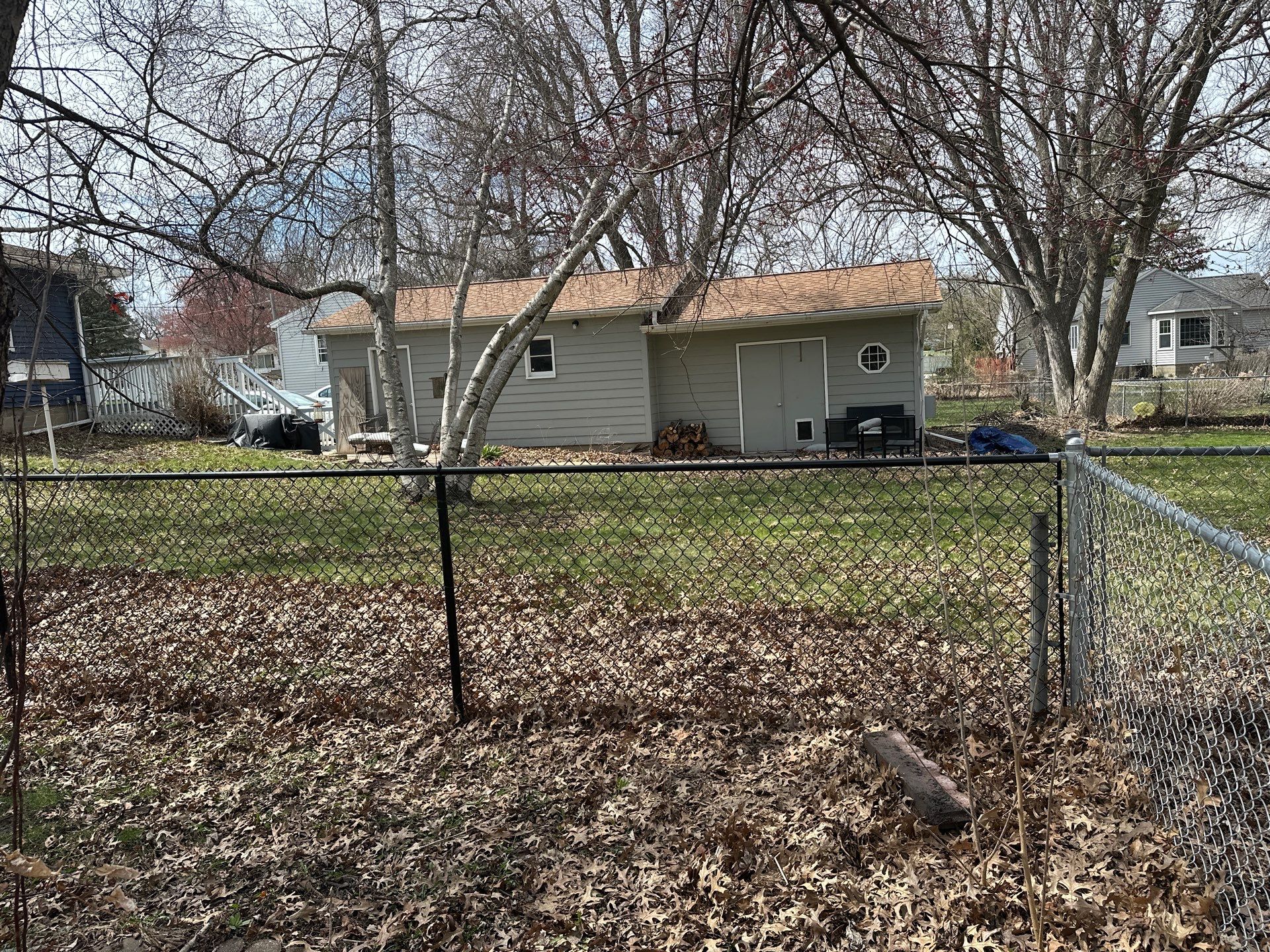 Black Vinyl-Coated Chain Link Fence Installation in Cedar Falls by Perfect Picket Fence and Stain