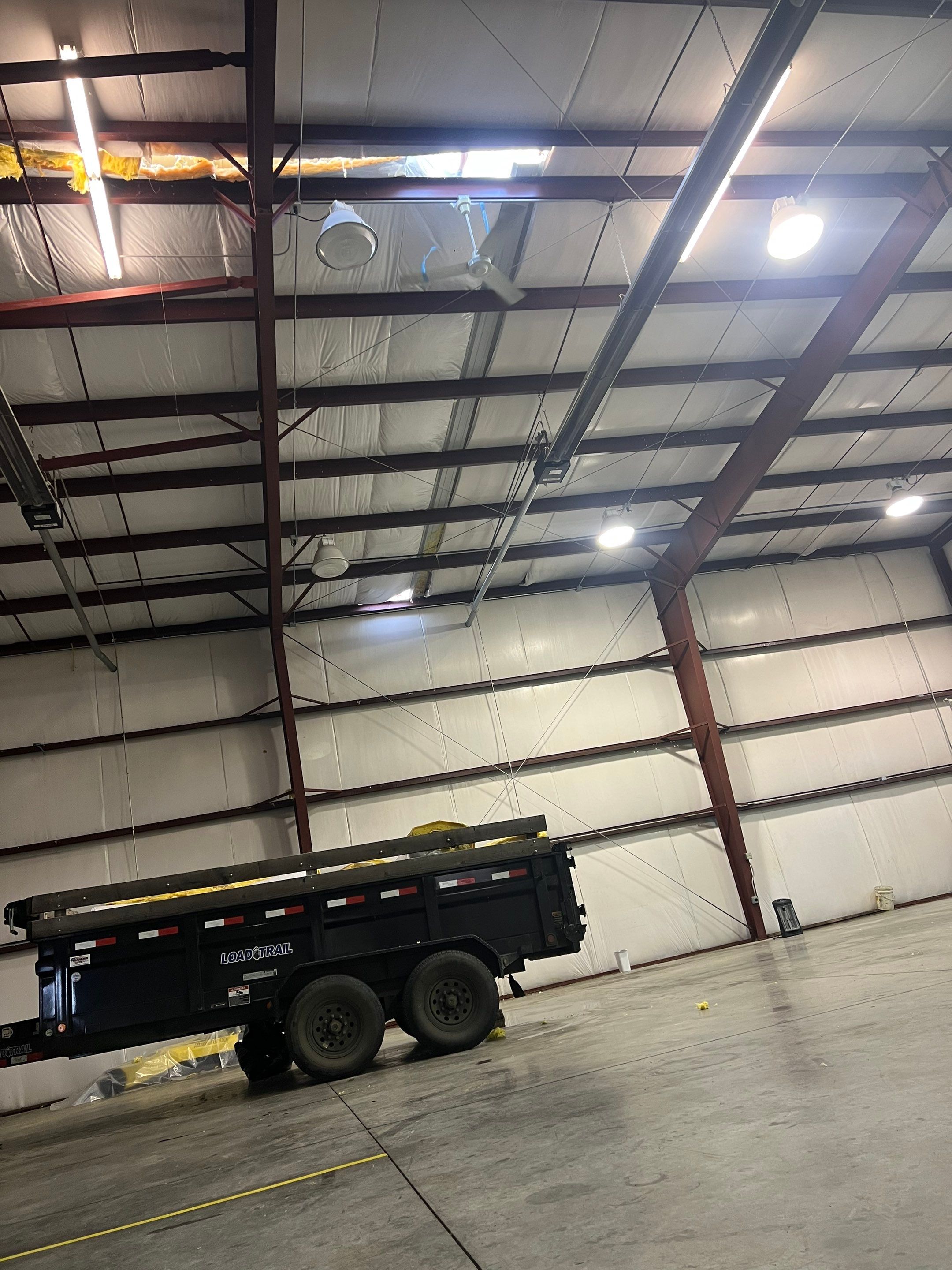 Airport Hanger Metal Roof Replacement and Insulation by Villegas Remodeling, LLC