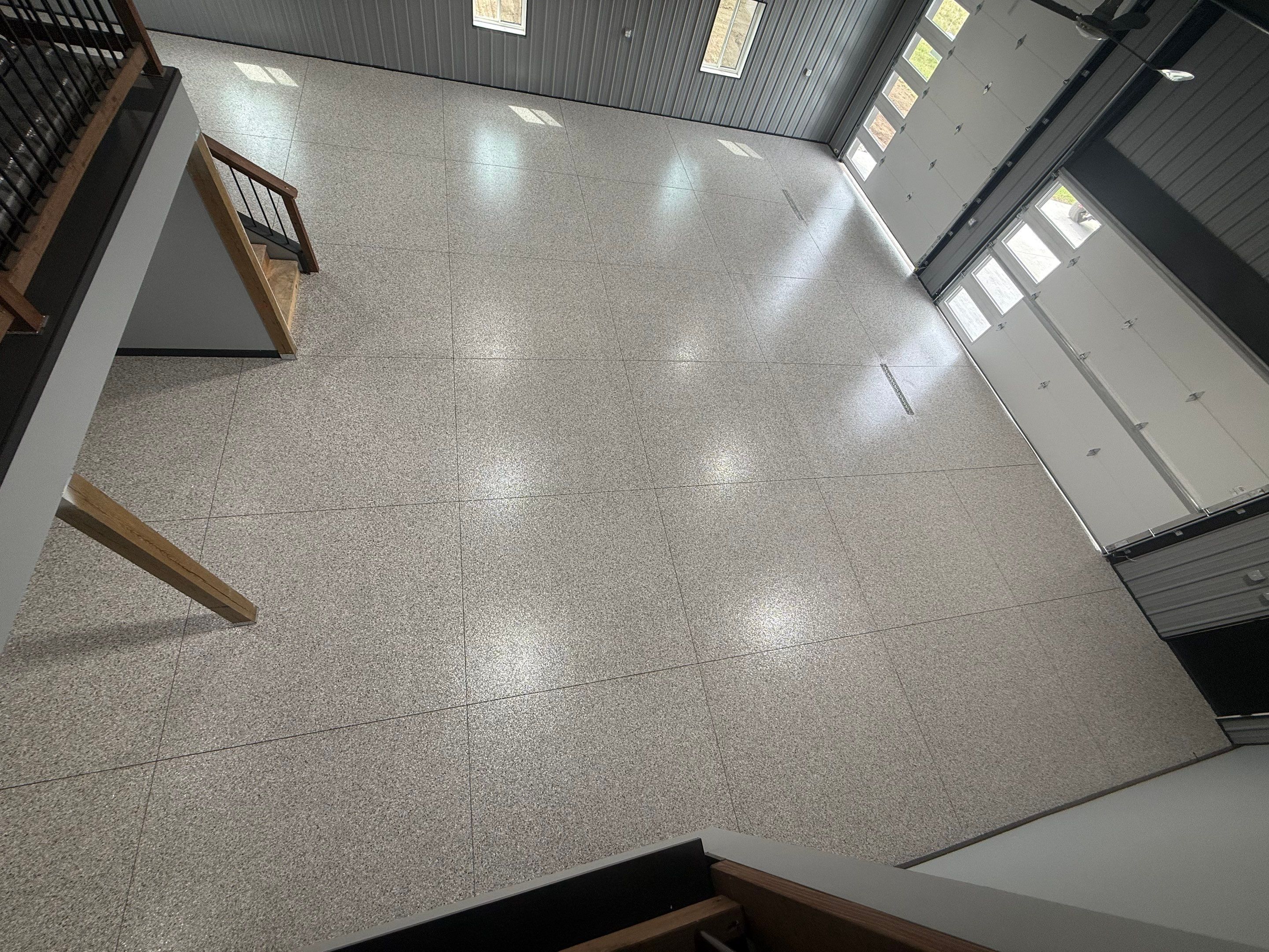 Polyaspartic Garage Floor Coating with Decorative Flake in Wentworth by Select Painting, Coatings & Garage Cabinets