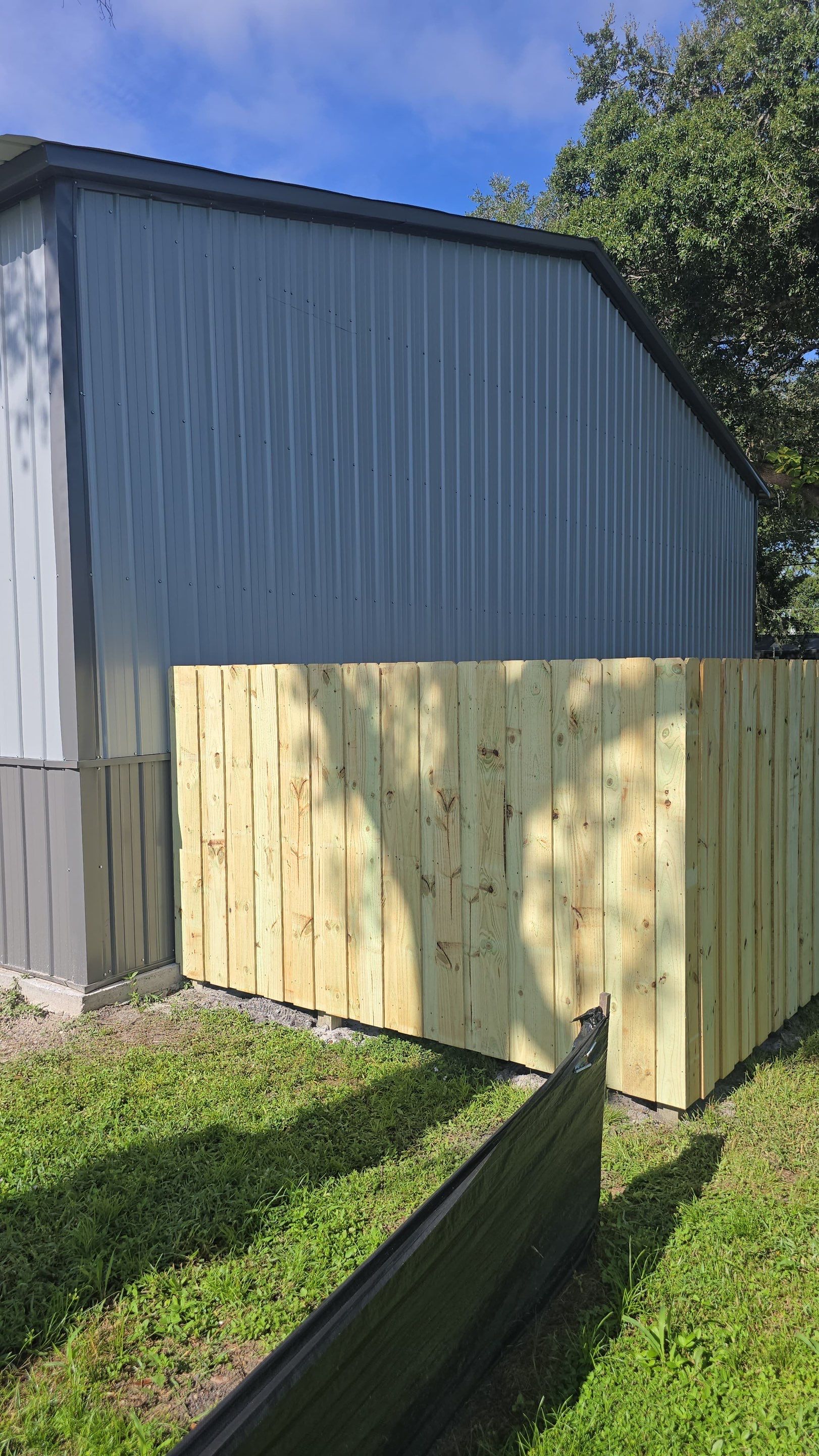 Pressure-Treated Wood Privacy Fence and Gate Installation in North Port by True Fence LLC
