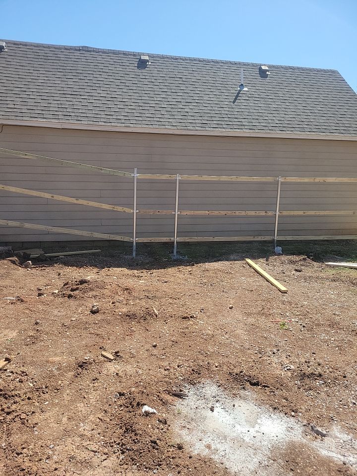 Cedar Fence using Cedar Pickets and Metal Poles by Clays Services Inc