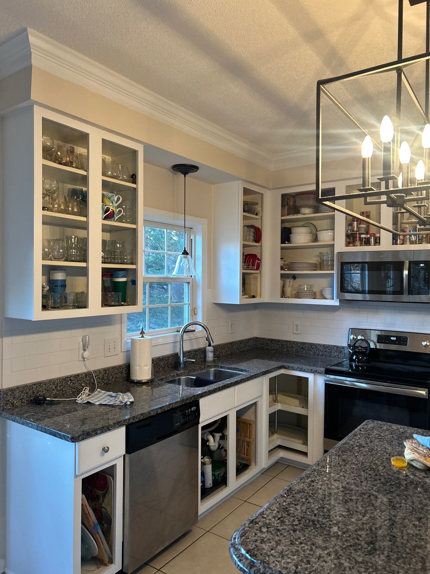 Cabinet painting by GonzalezPainters & Contractors Inc 