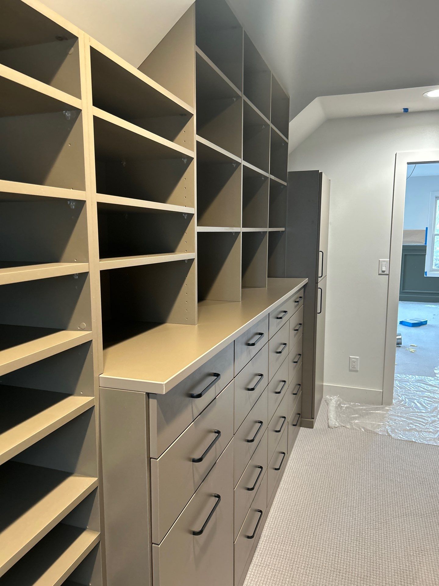 Enjoy a Morning Latte in this Walk-in Closet by Concept 32, Inc.