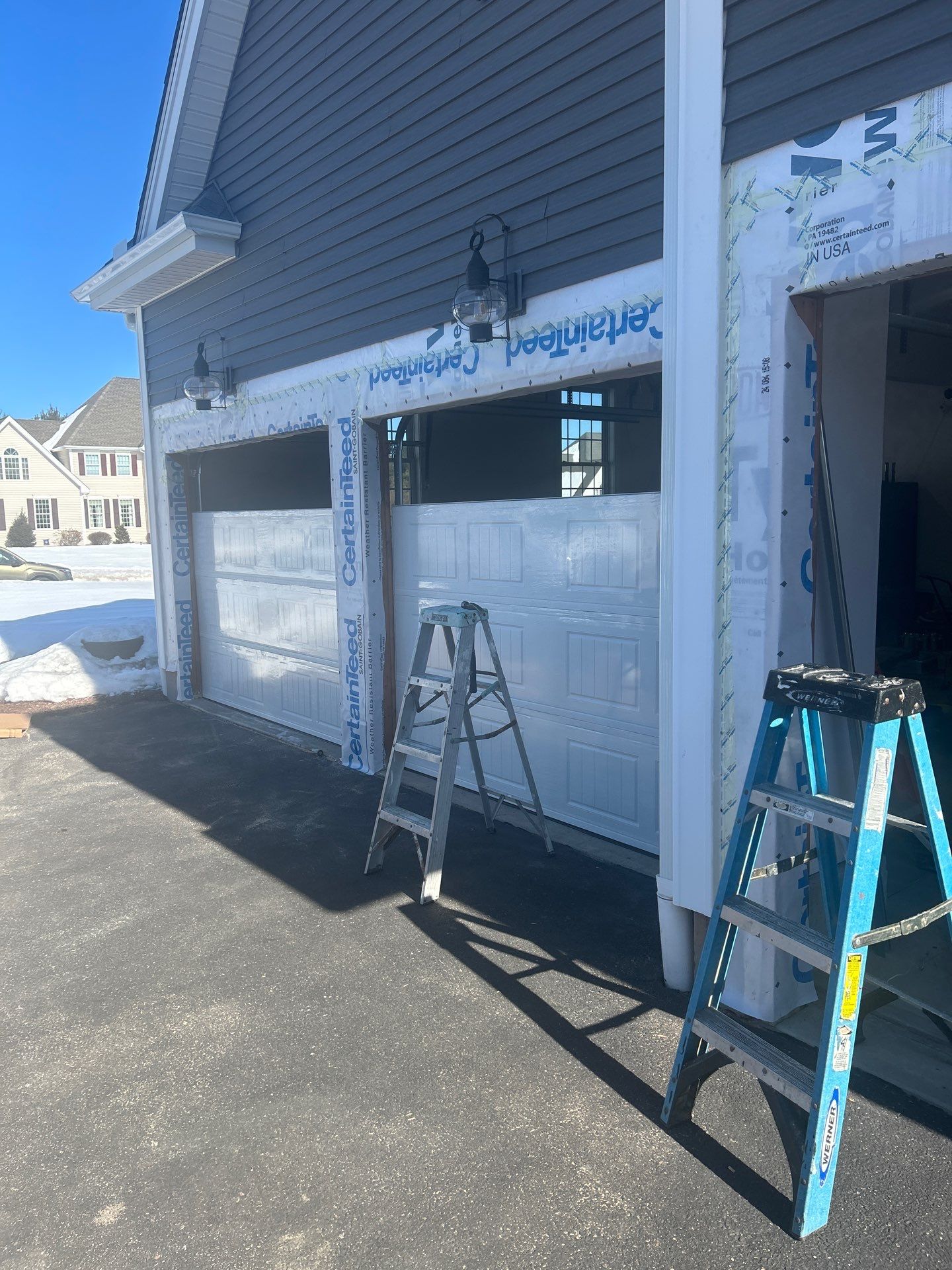 Garage Door Upgrade with Classic Style & Window Accents by DiGiorgi Roofing and Siding Inc