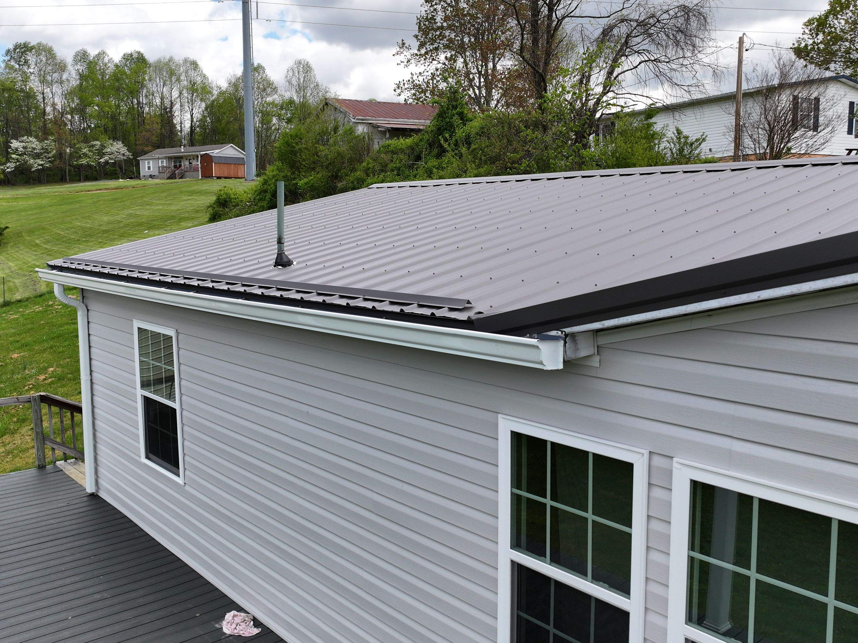 Charcoal Gray Textured Metal Roof by Omnia Roofing