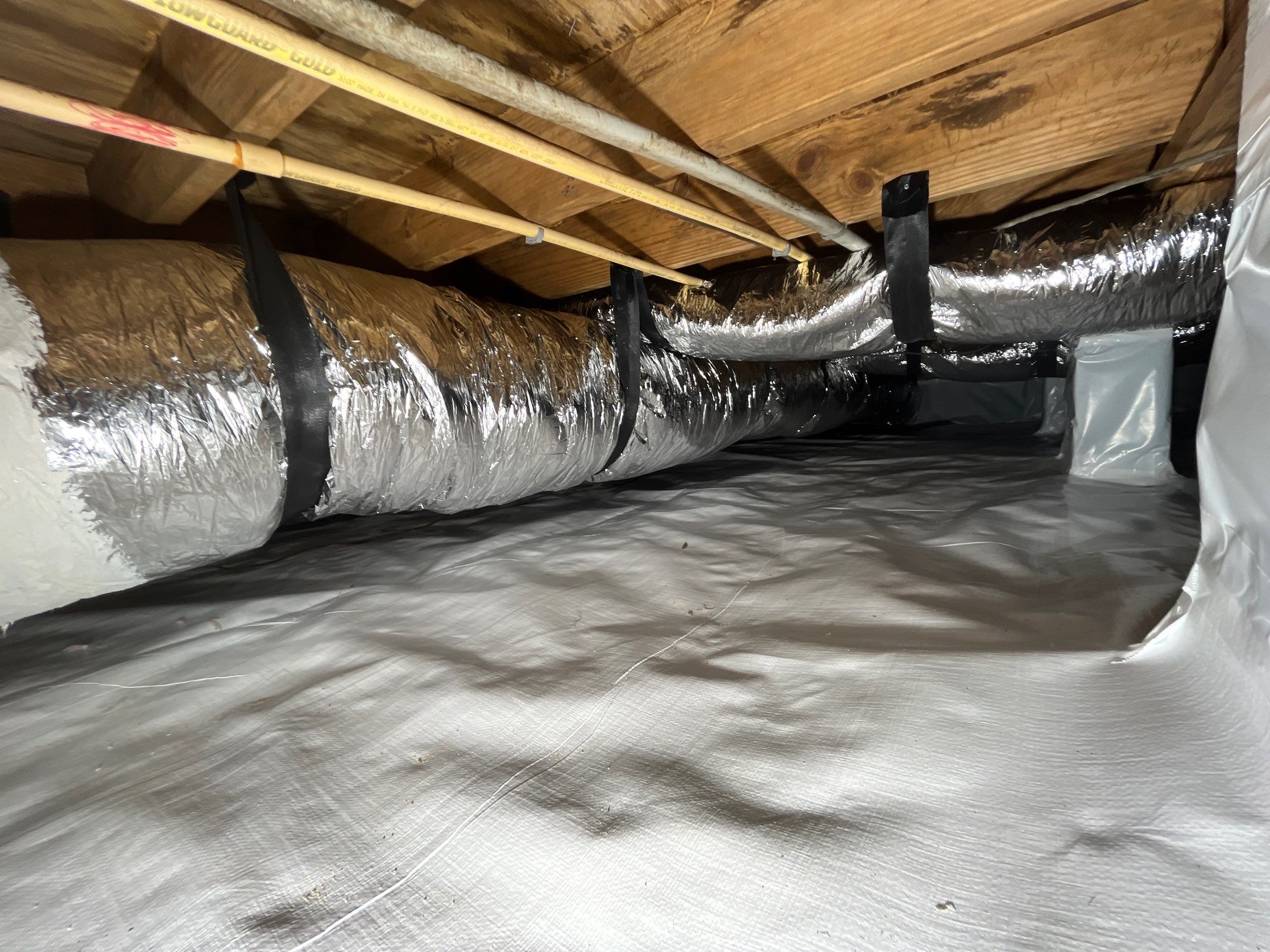 Crawlspace remediation & encapsulation with ductwork replacement by EAS Environmental, LLC.