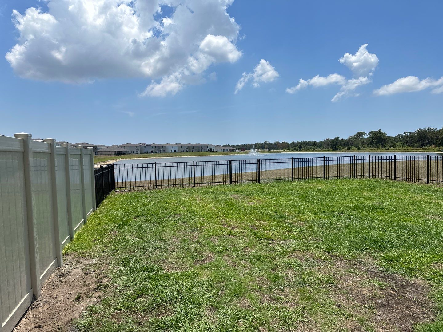 Aluminum Fence Installation using Black 3 Rail Aluminum Fence and Tan Vinyl Privacy Fence by Asap fence and gates, LLC