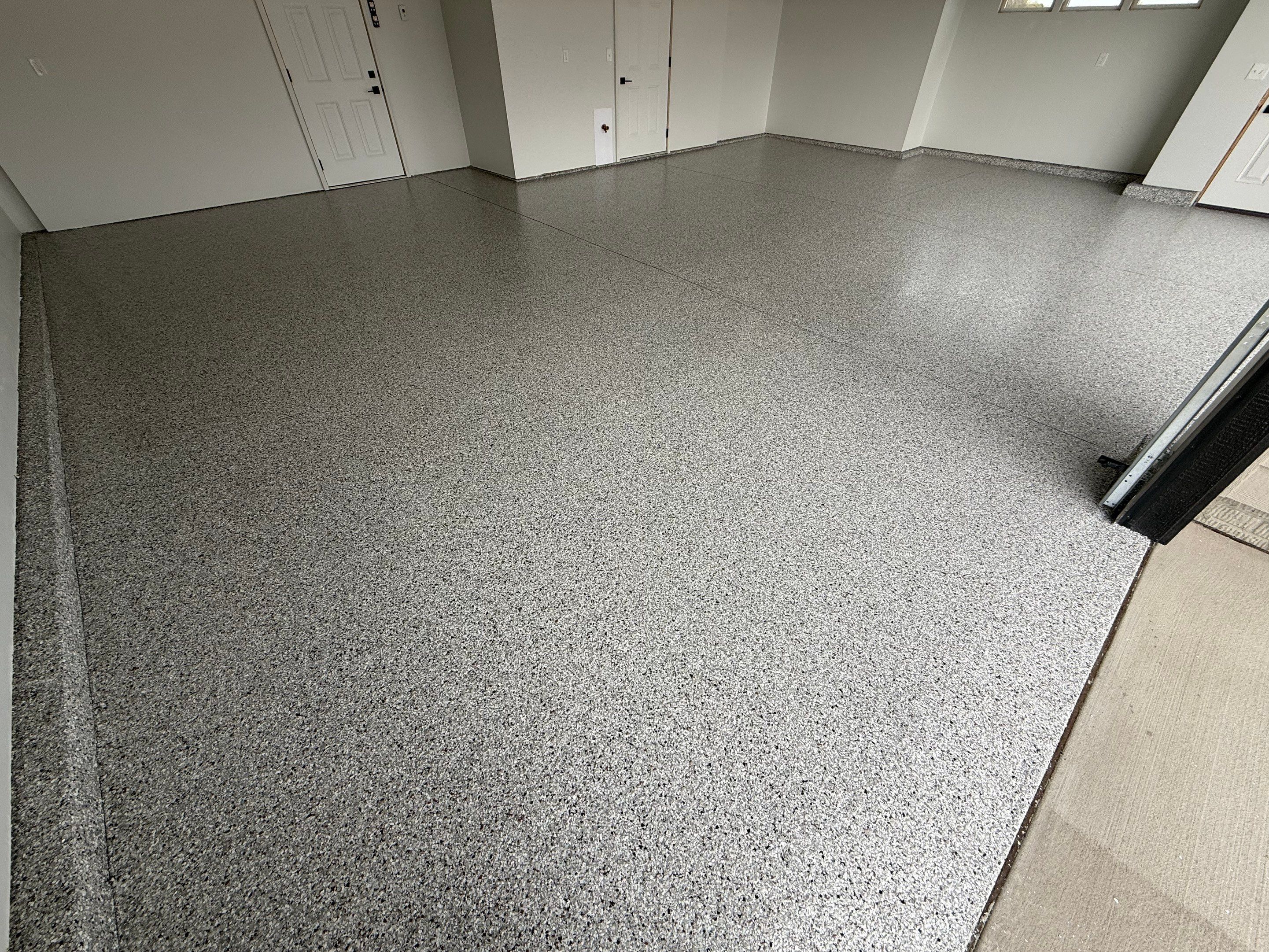 High-Gloss Epoxy Flake Garage Floor Coating in Brandon by Select Painting, Coatings & Garage Cabinets
