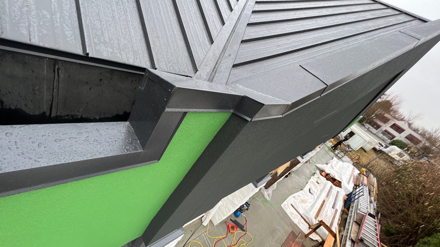 Commercial Roofing Installation using 12" Prolok metal and hidden gutters! by Top Notch Roofing Inc