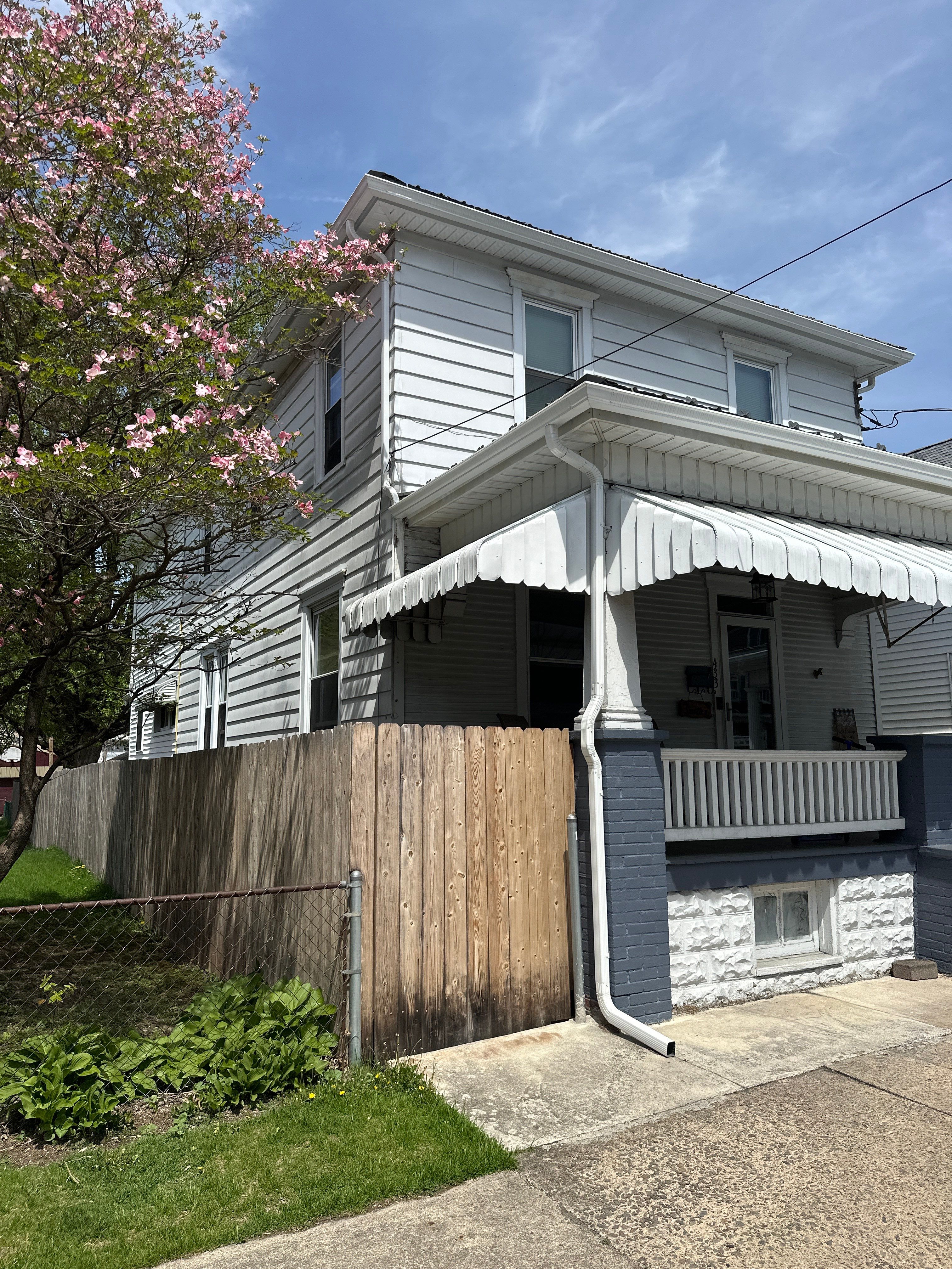Charcoal Metal Roof & Blue Siding — A Refreshing New Look by Esh Builders