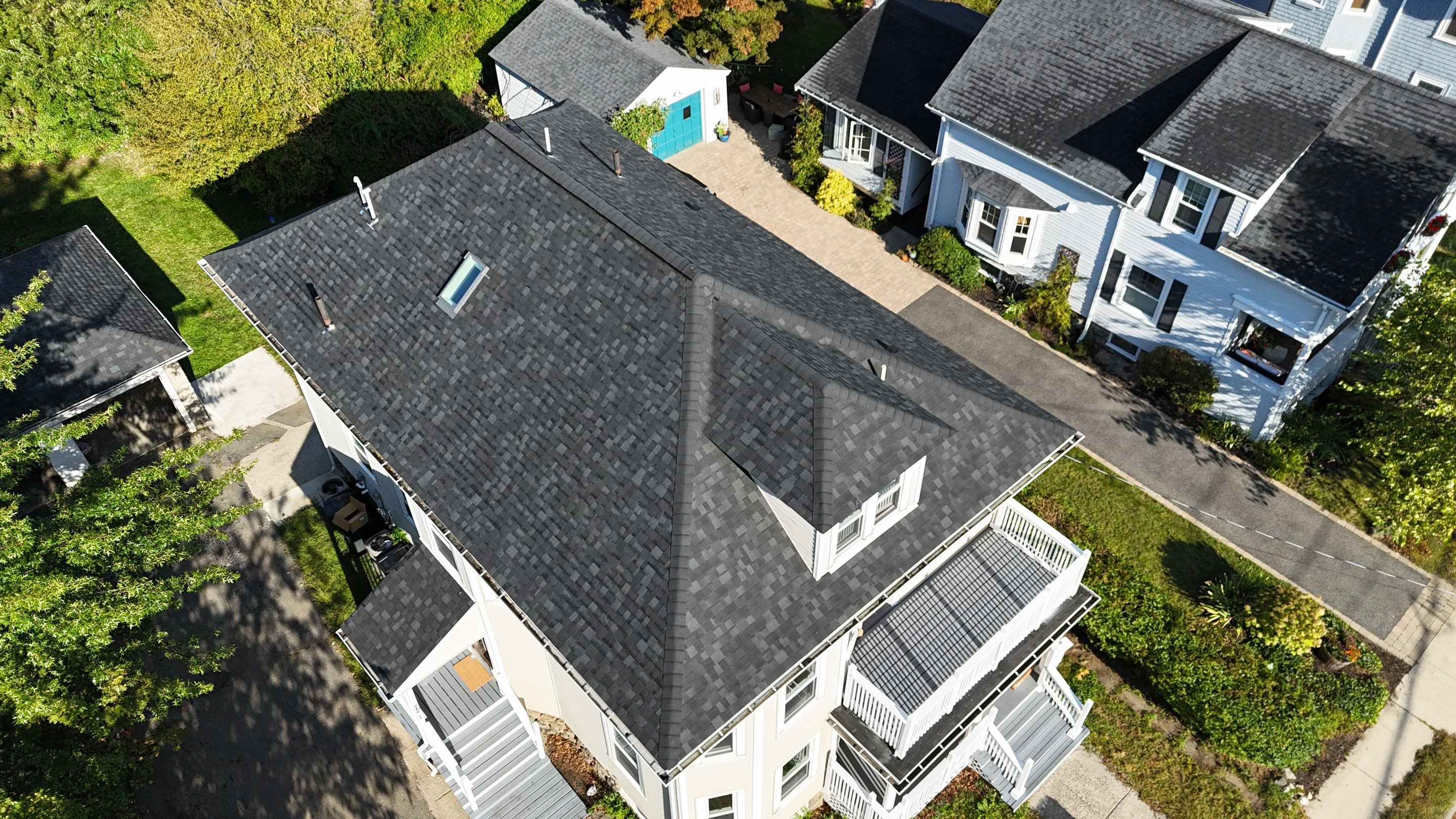 Roof Replacement with Skylight Flashing in Waltham, MA by Mighty Dog Roofing of Greater Middlesex County